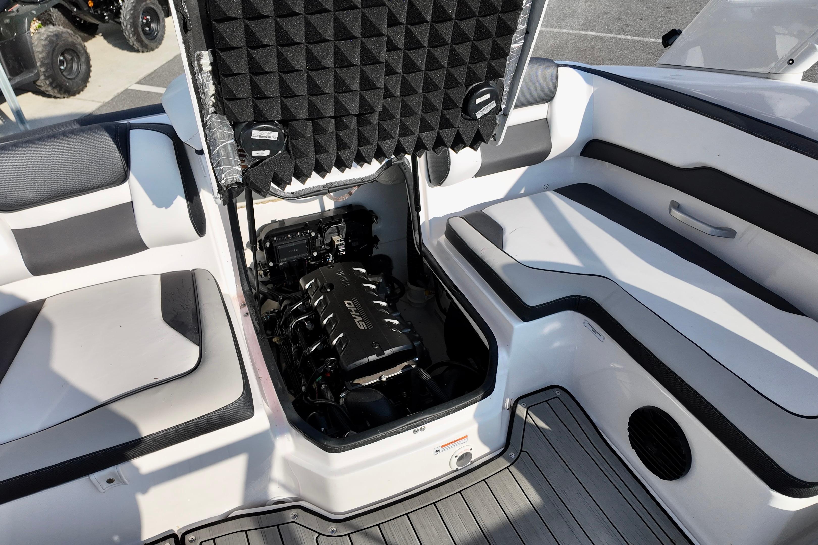 2023 Yamaha 195S boat interior showing engine compartment and seating area.