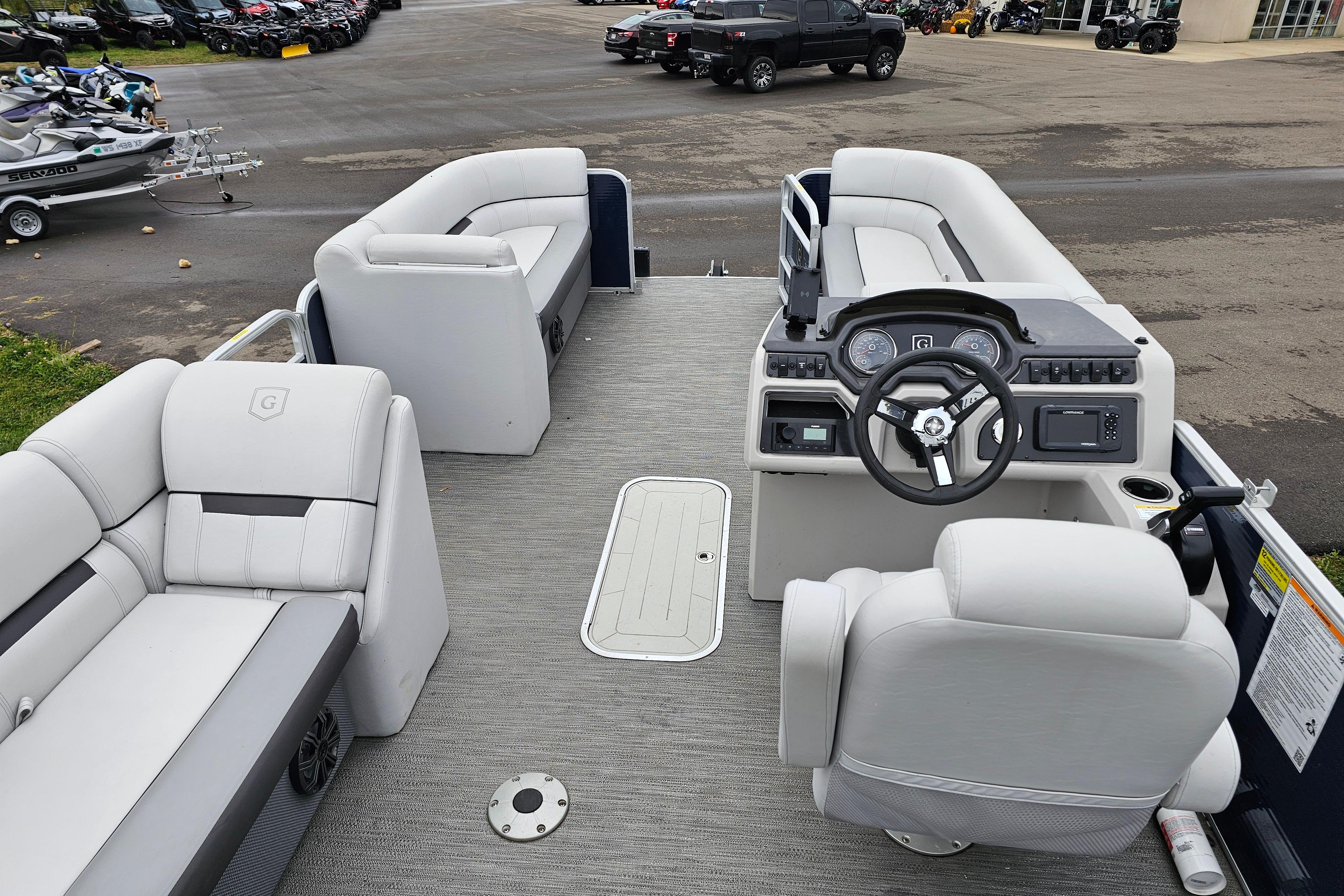 2022 Sweetwater 2286 SFL pontoon boat interior with modern seating and steering console.