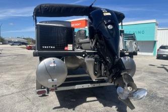 2026 Princecraft Vectra 23 L pontoon boat with outboard motor in a parking lot.
