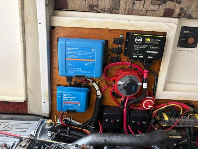 Electrical components and wiring in a boat's engine compartment.