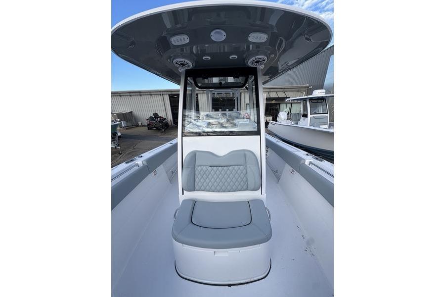 2026 Sportsman Open 282 Center Console boat interior with seating and console view.