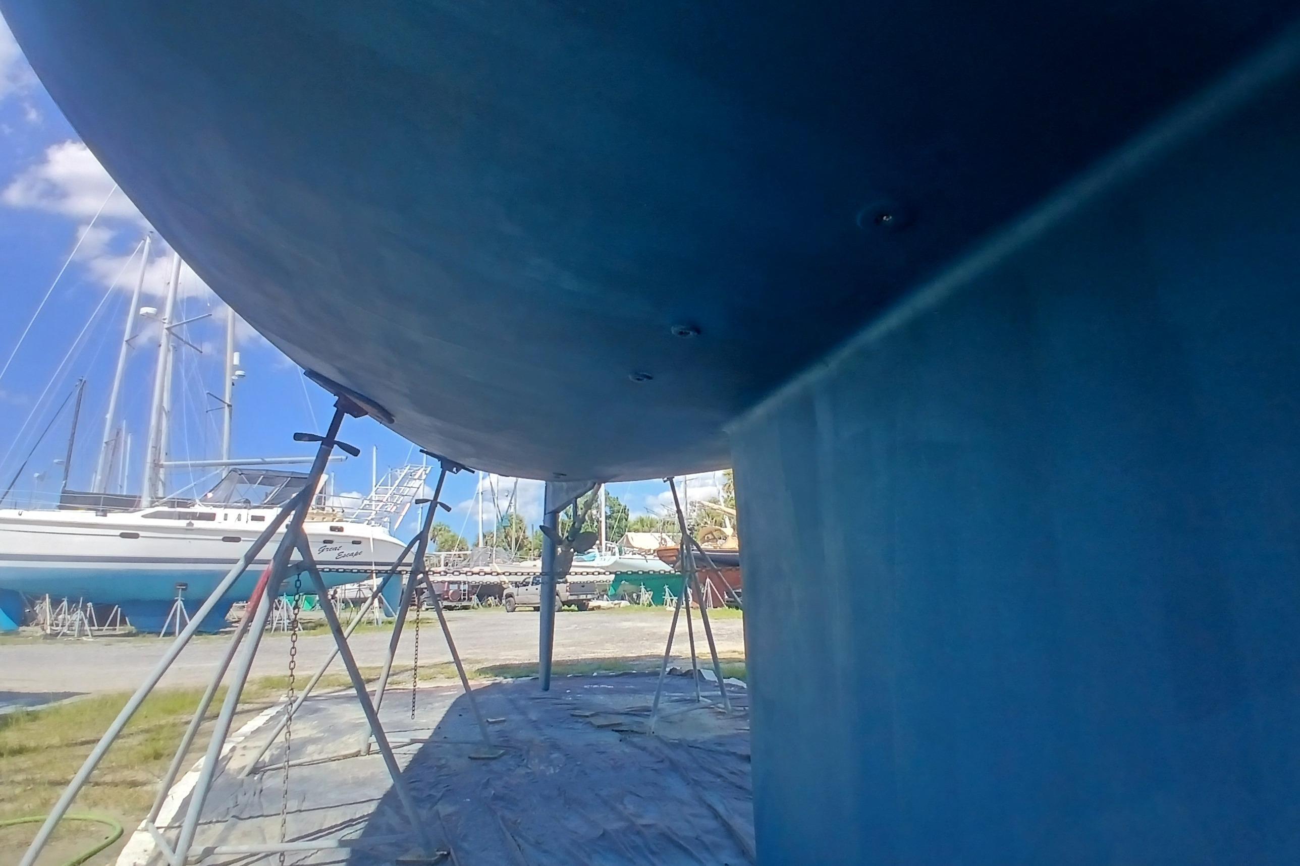 Catalina 42 MkII sailboat hull in dry dock, 1995 model, with clear blue sky.