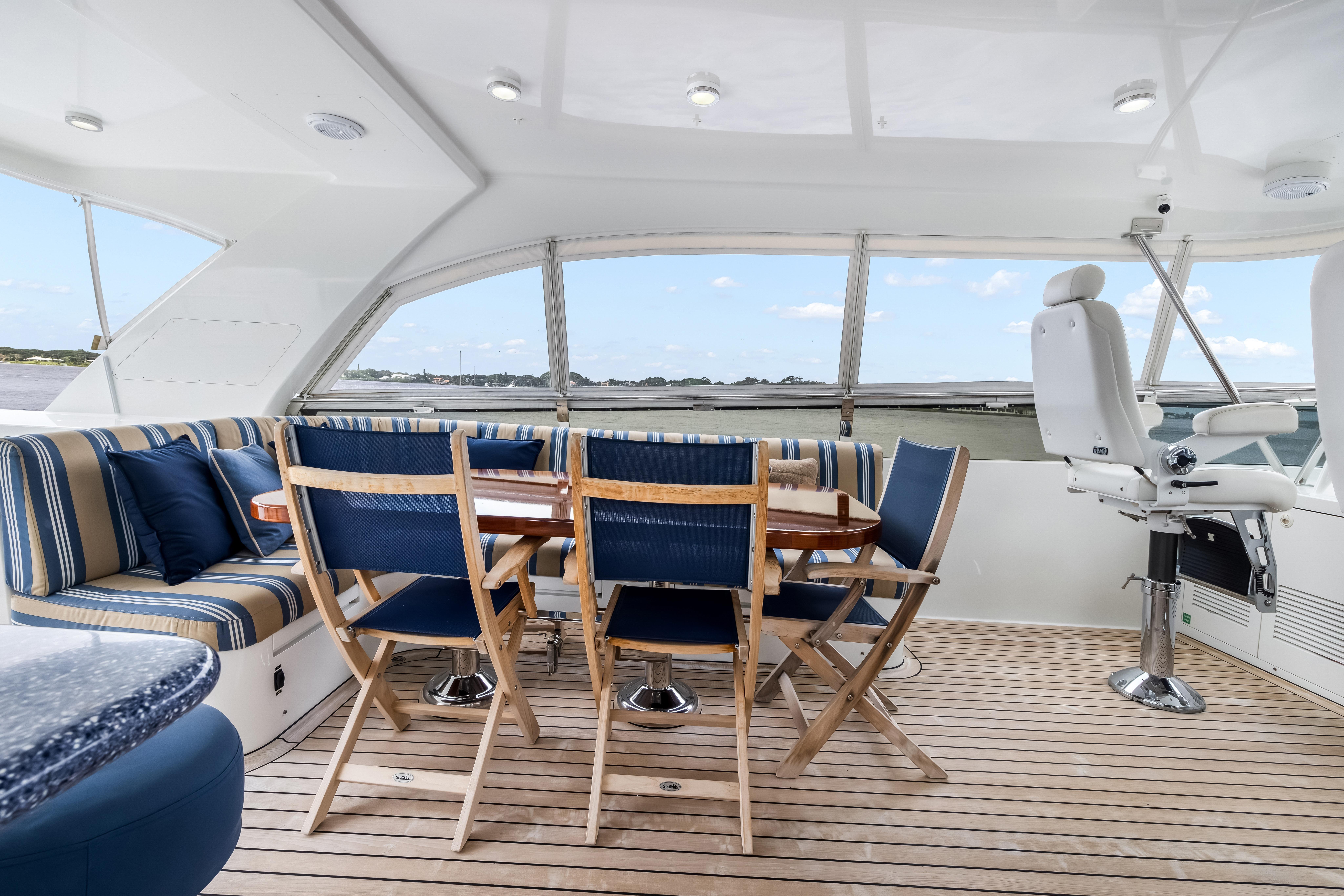 Luxurious 2012 Cheoy Lee 84 Bravo yacht interior with elegant seating and dining area.