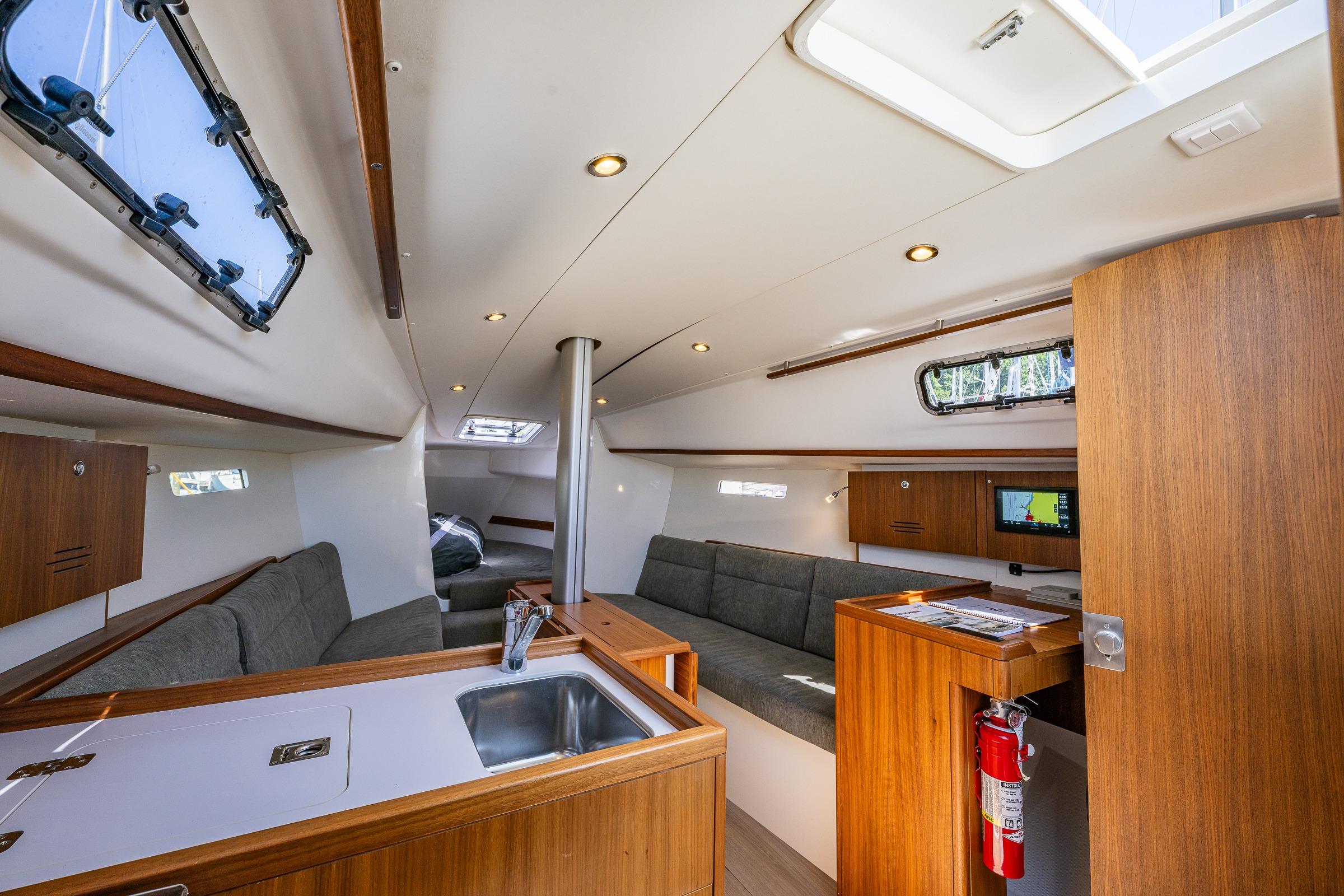 Interior of 2018 J Boats J/97E sailboat with modern wood finish and seating area.