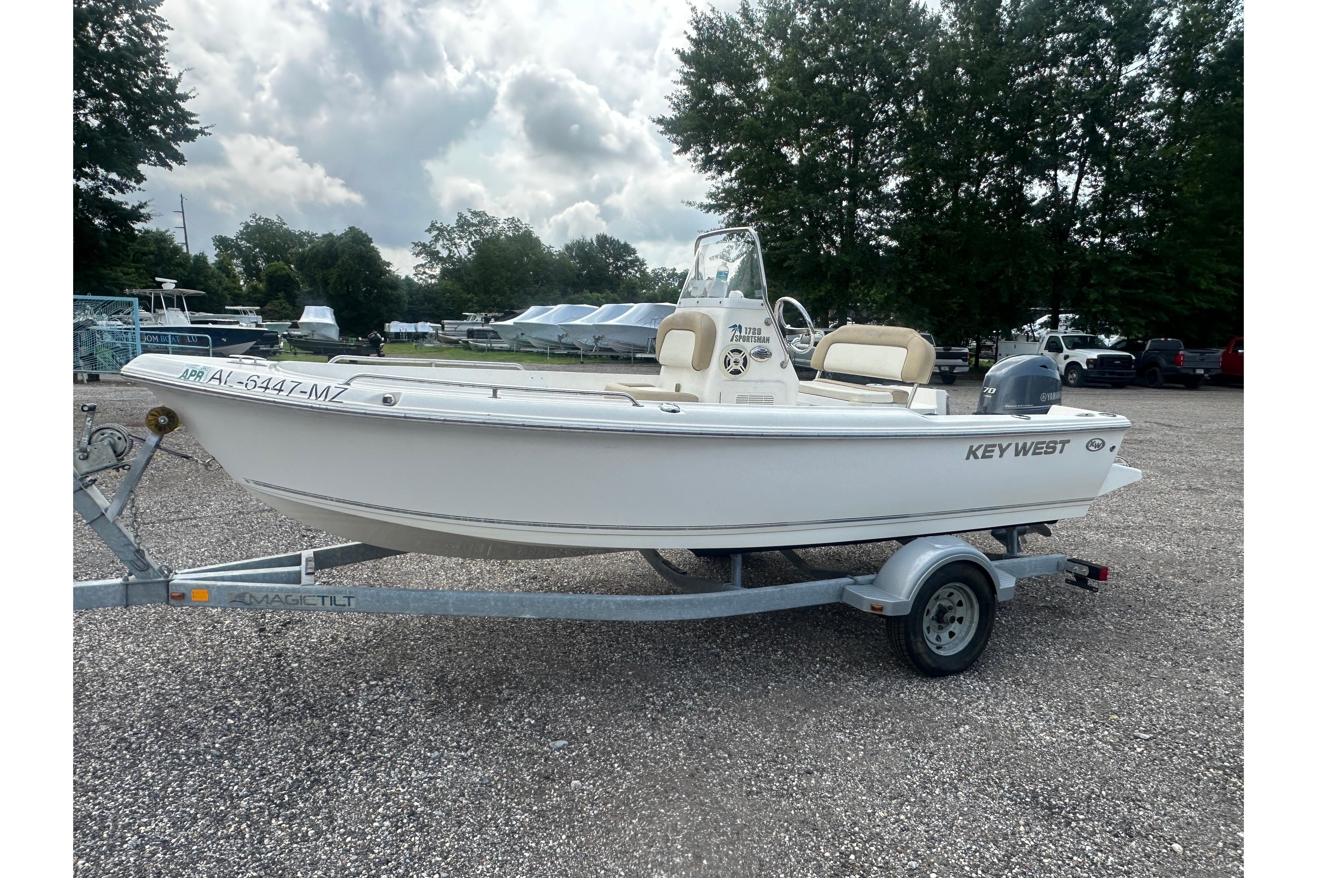 2018 Key West 1720 Center Console boat on trailer, parked outdoors.
