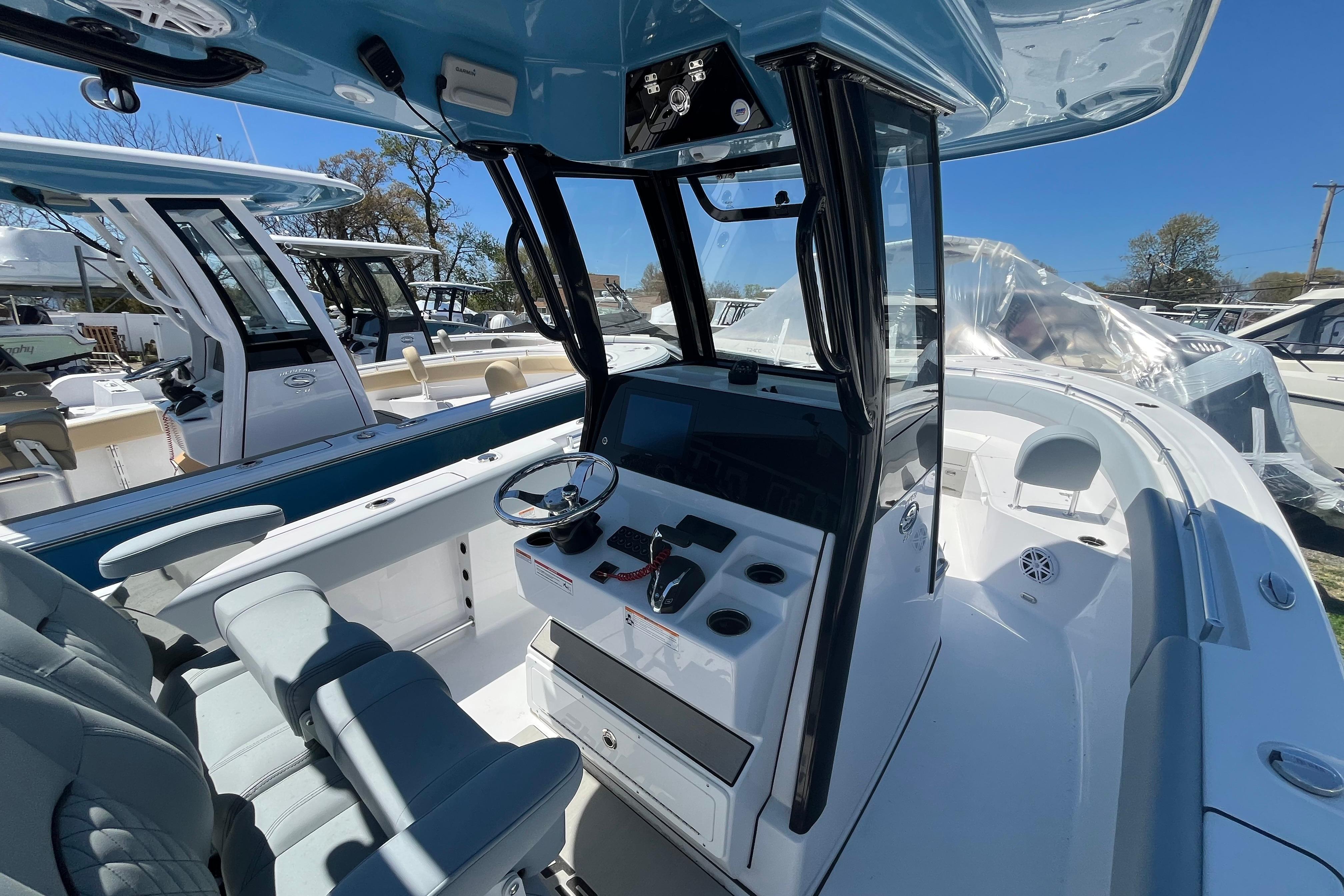 2026 Sportsman Open 252 Center Console boat interior with modern helm and seating.