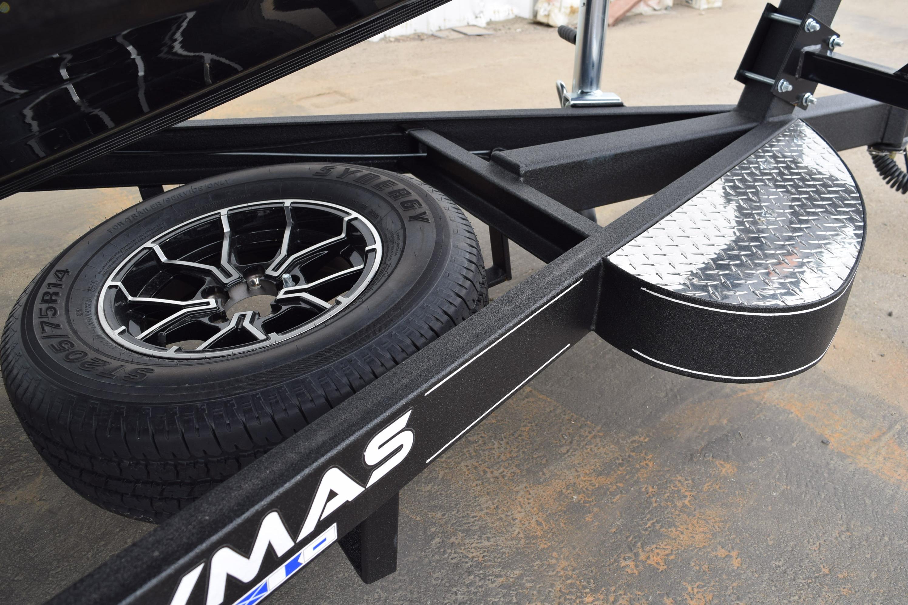 Trailer wheel and fender of 2027 Cayams CX 20 PRo, featuring sleek design and sturdy construction.
