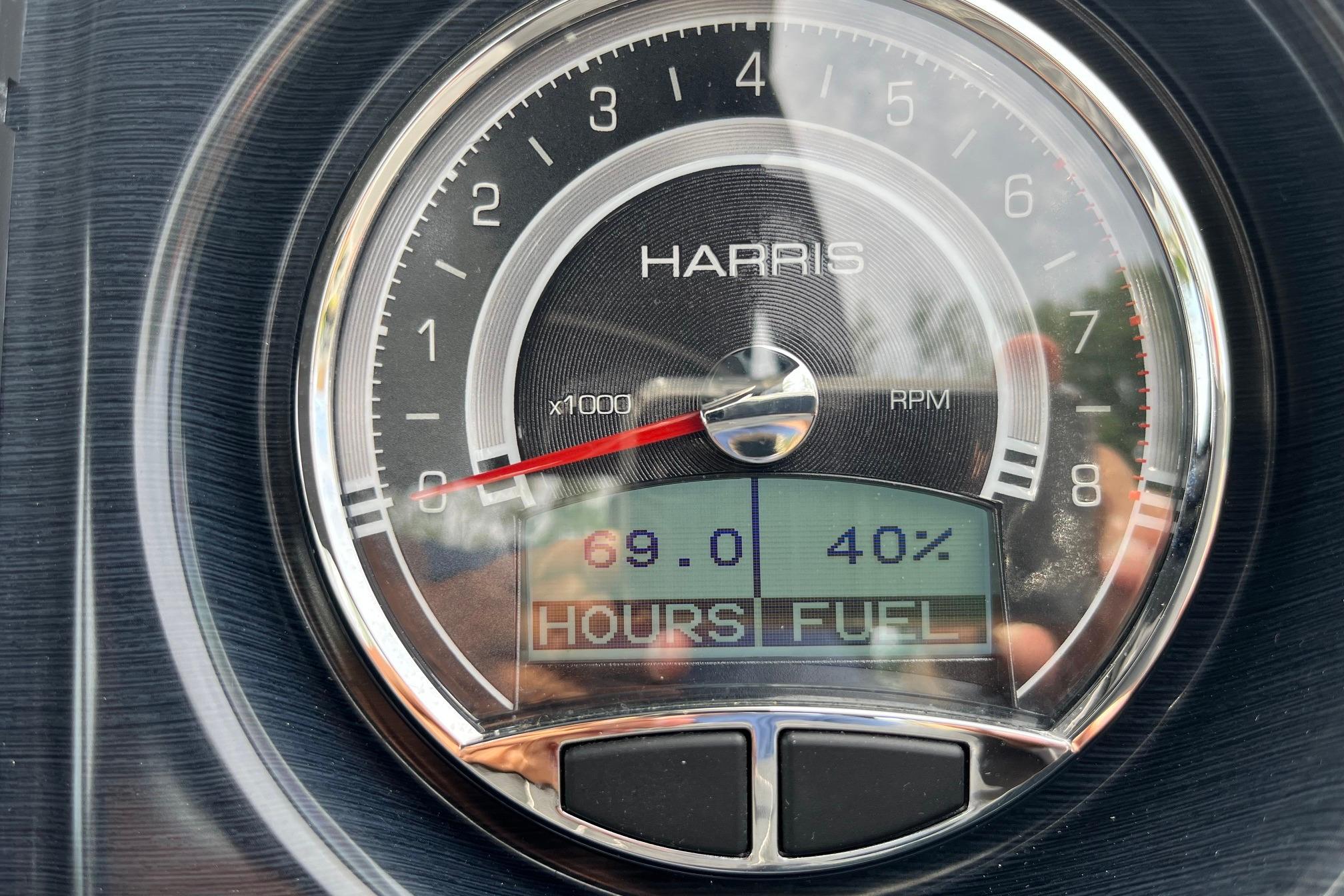 Close-up of 2024 Harris Grand Mariner 250 RPM gauge displaying 69 hours and 40% fuel.