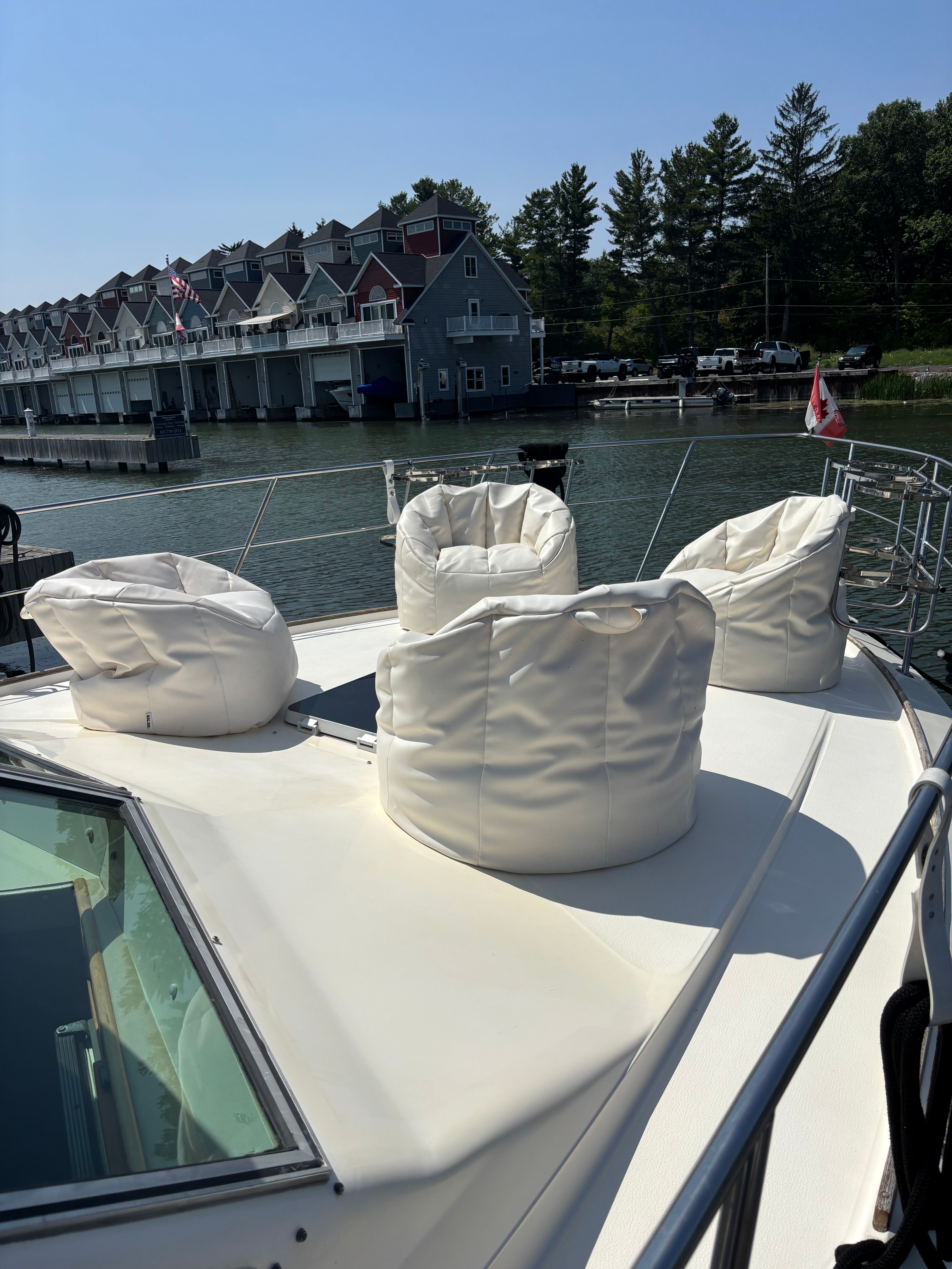 1986 Sea Ray 360 Aft Cabin with white bean bags on deck.