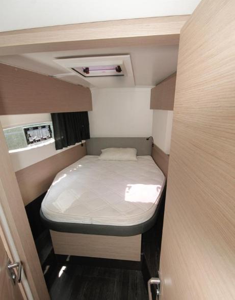 2021 Fountaine Pajot Catamaran Astrea 42 cabin with bed, modern interior design.