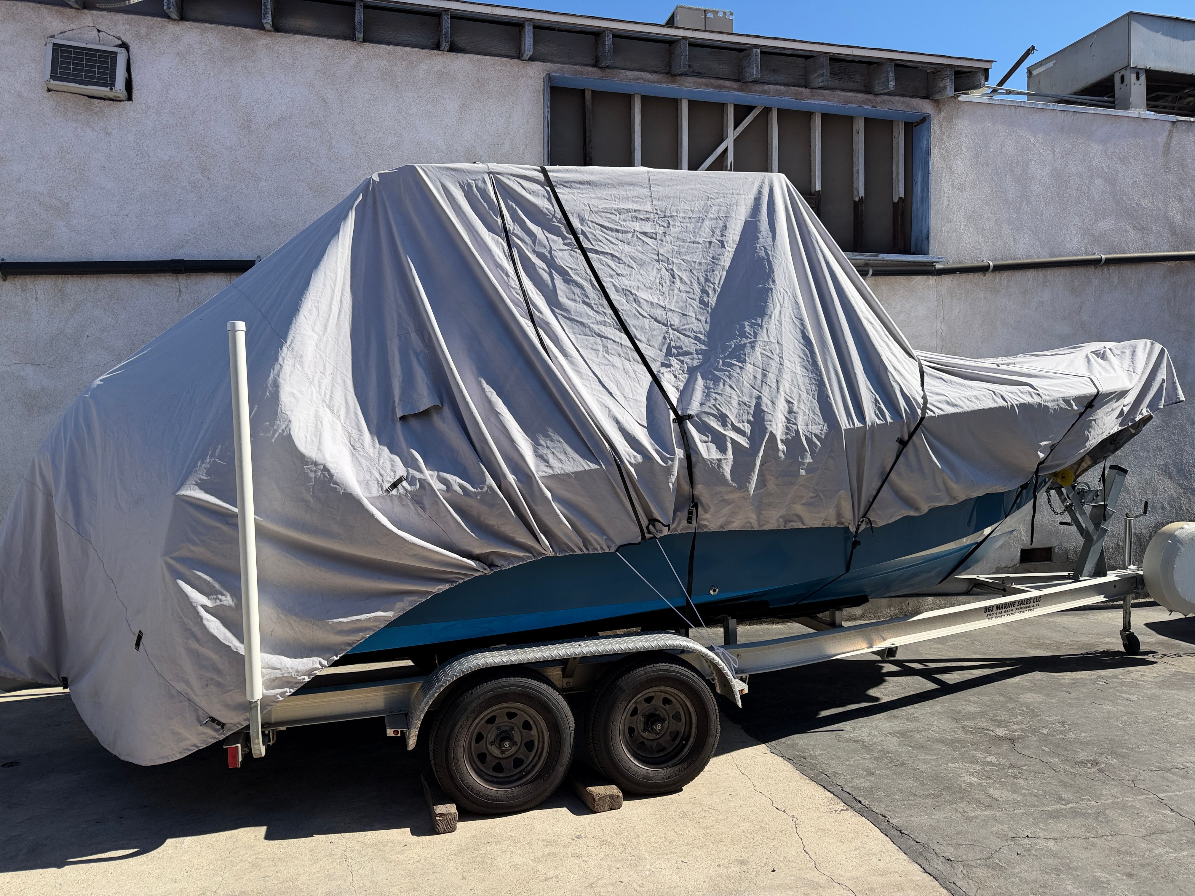 Covered KenCraft Challenger boat on trailer, year 2021.