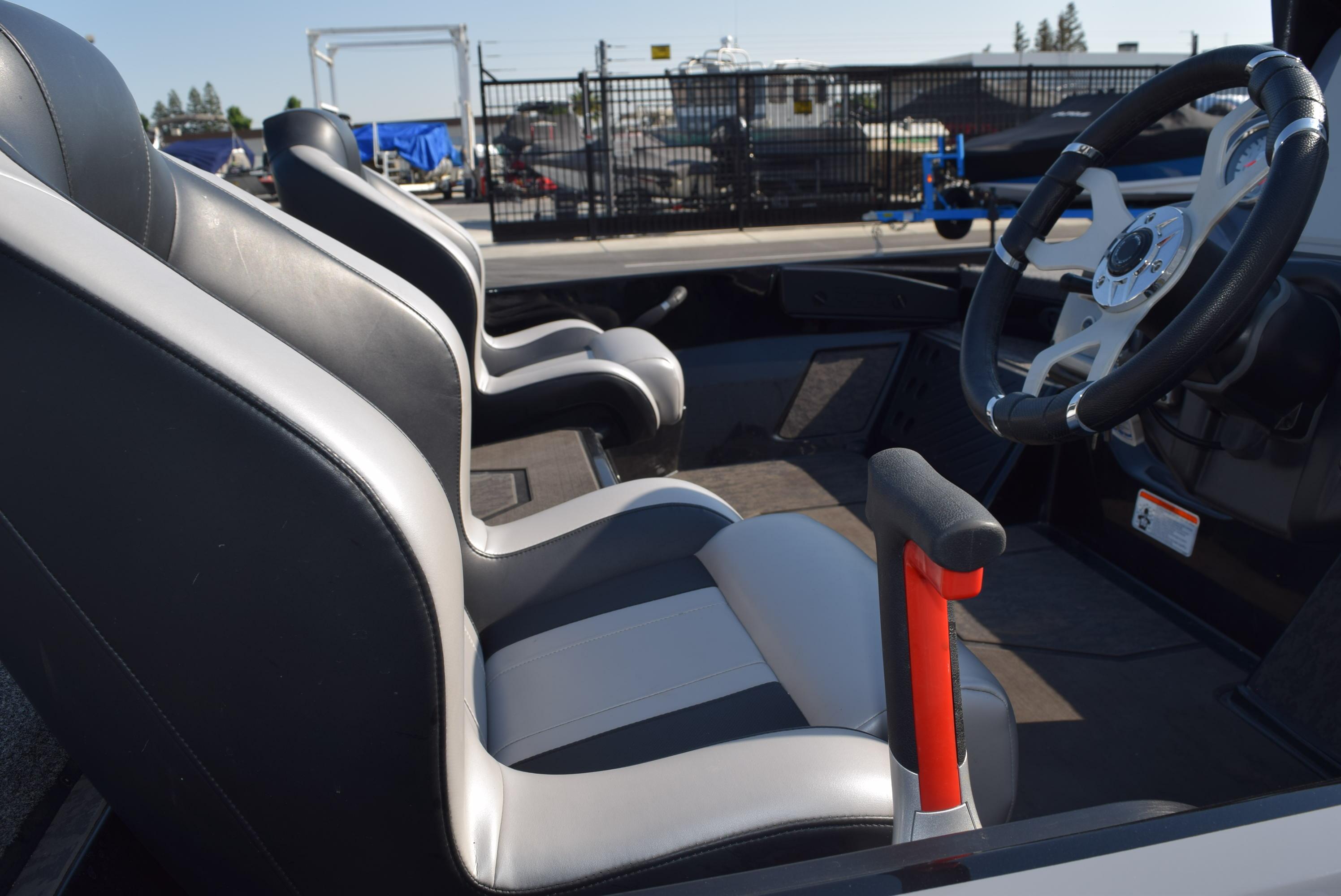 Interior of 2025 Nitro Z20 XL Pro boat with sleek seating and steering wheel.