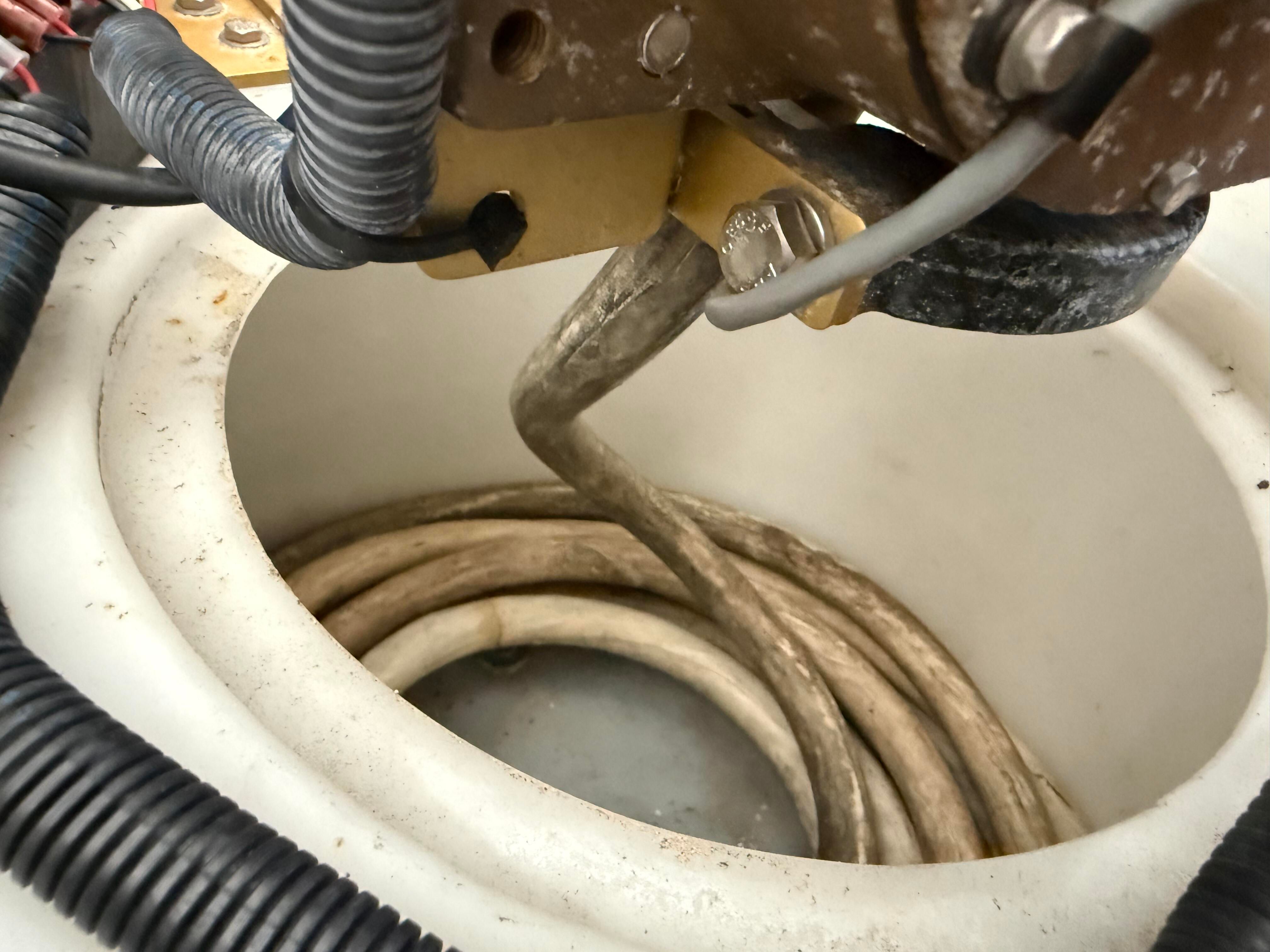 Close-up of an anchor locker with ropes and cables.