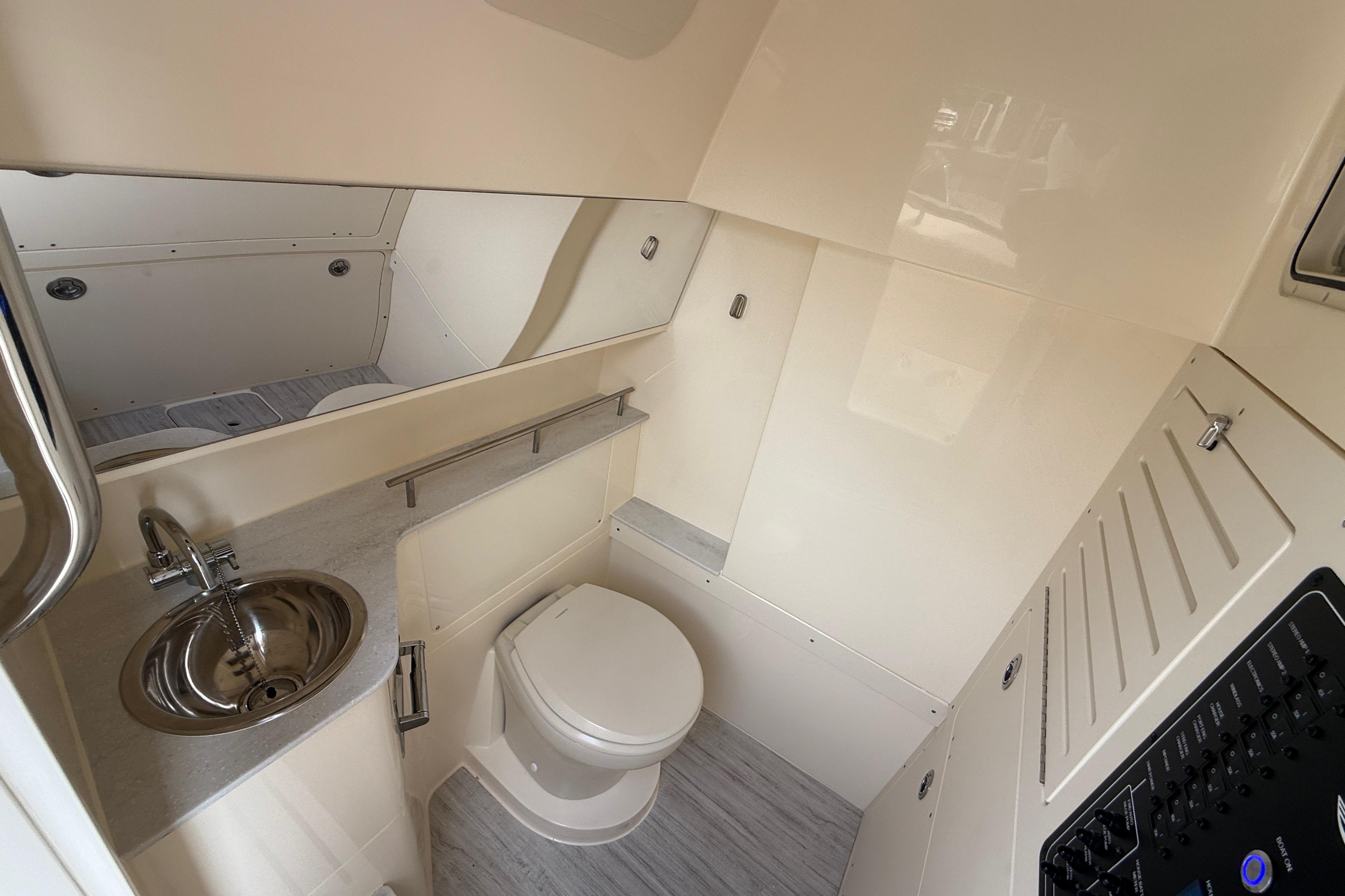 2026 Scout 288 LXF boat interior bathroom with modern fixtures and sleek design.