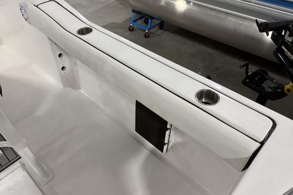 2026 Tidewater 232 CC Adventure boat interior with cup holders and sleek design.
