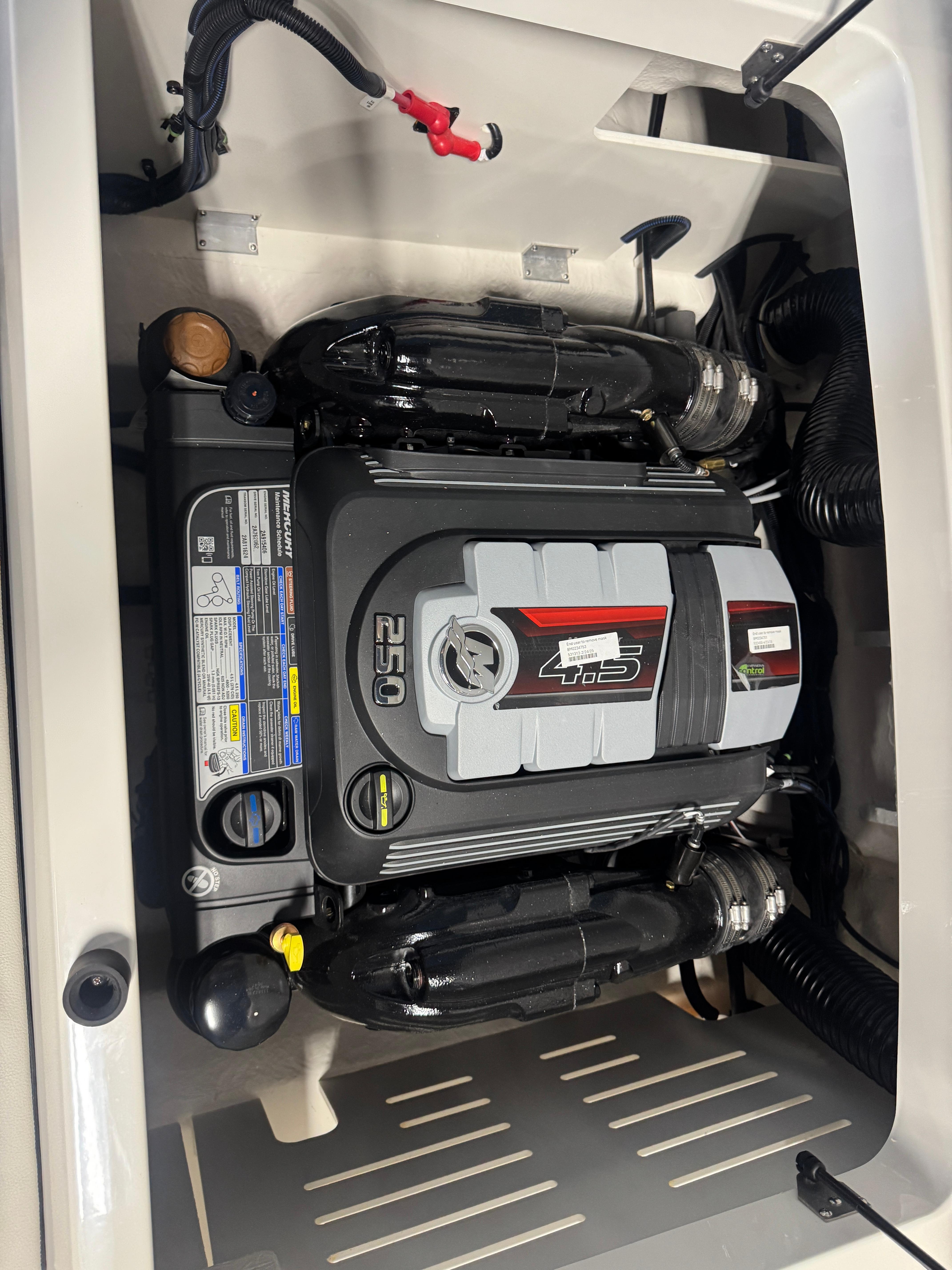 Engine compartment of a 2026 Sea Ray SPX 210 boat, featuring a 250 horsepower engine.