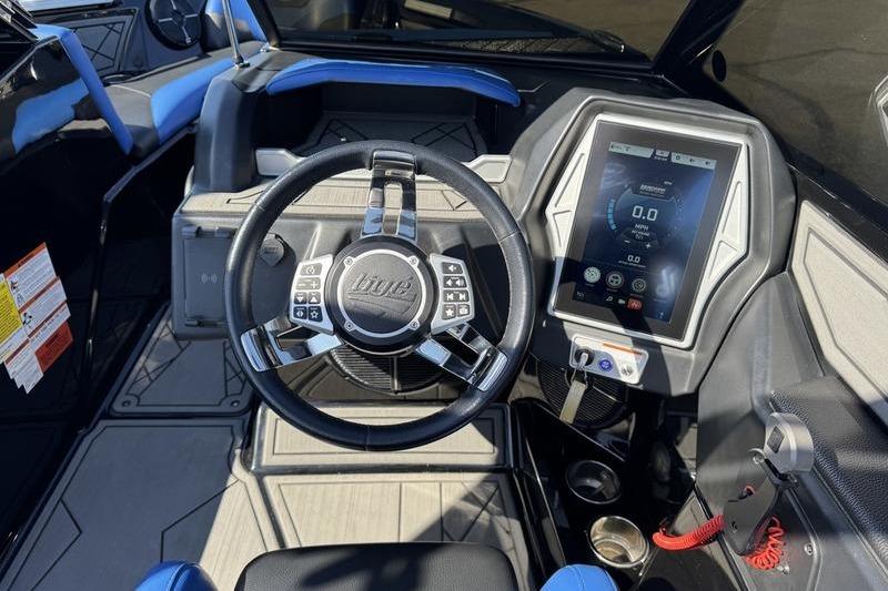 2022 Tigé Z3 boat dashboard with touchscreen display and steering wheel controls.