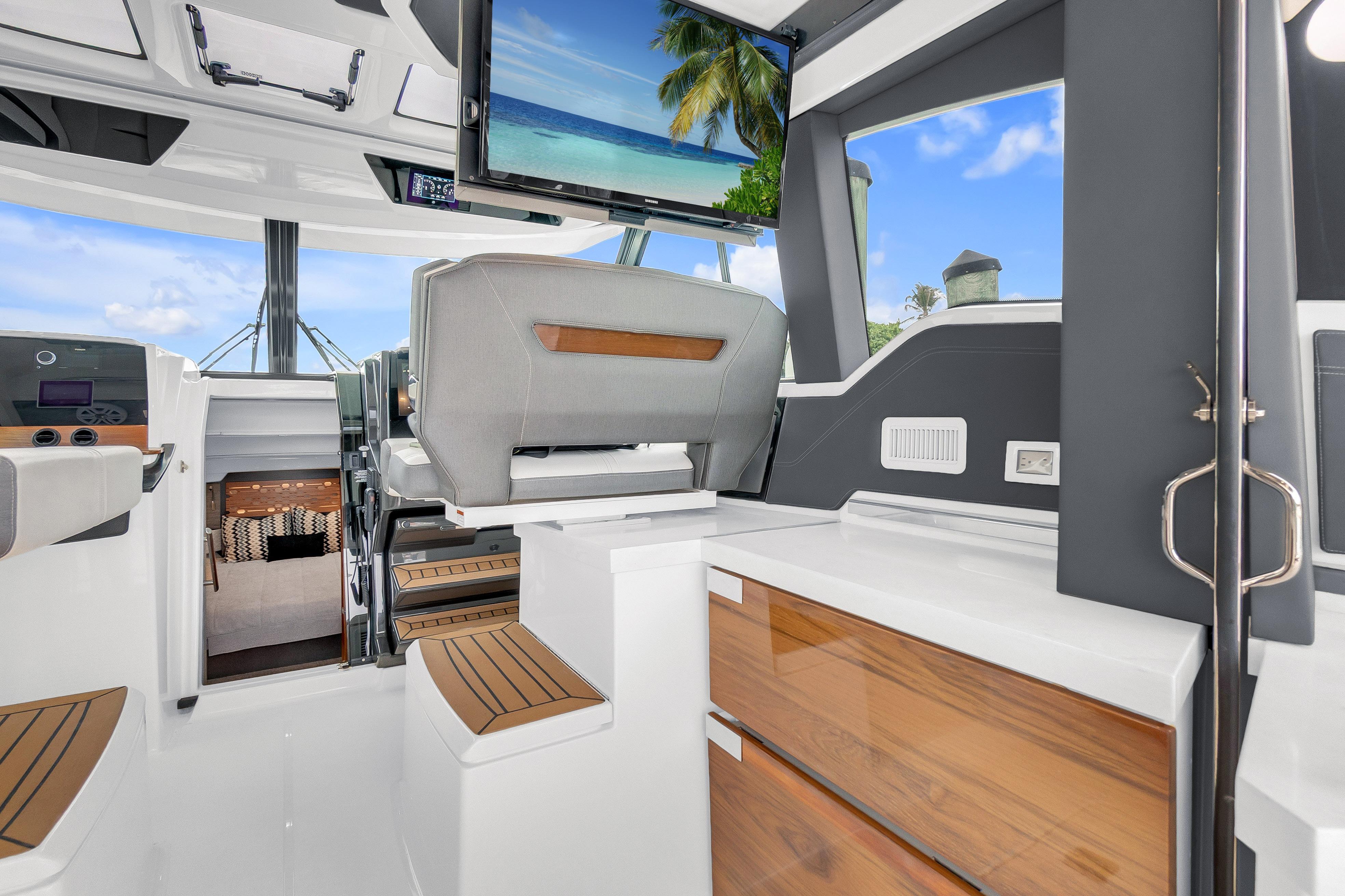 Interior of 2021 Tiara Sport 43 LE yacht with modern seating and TV display.