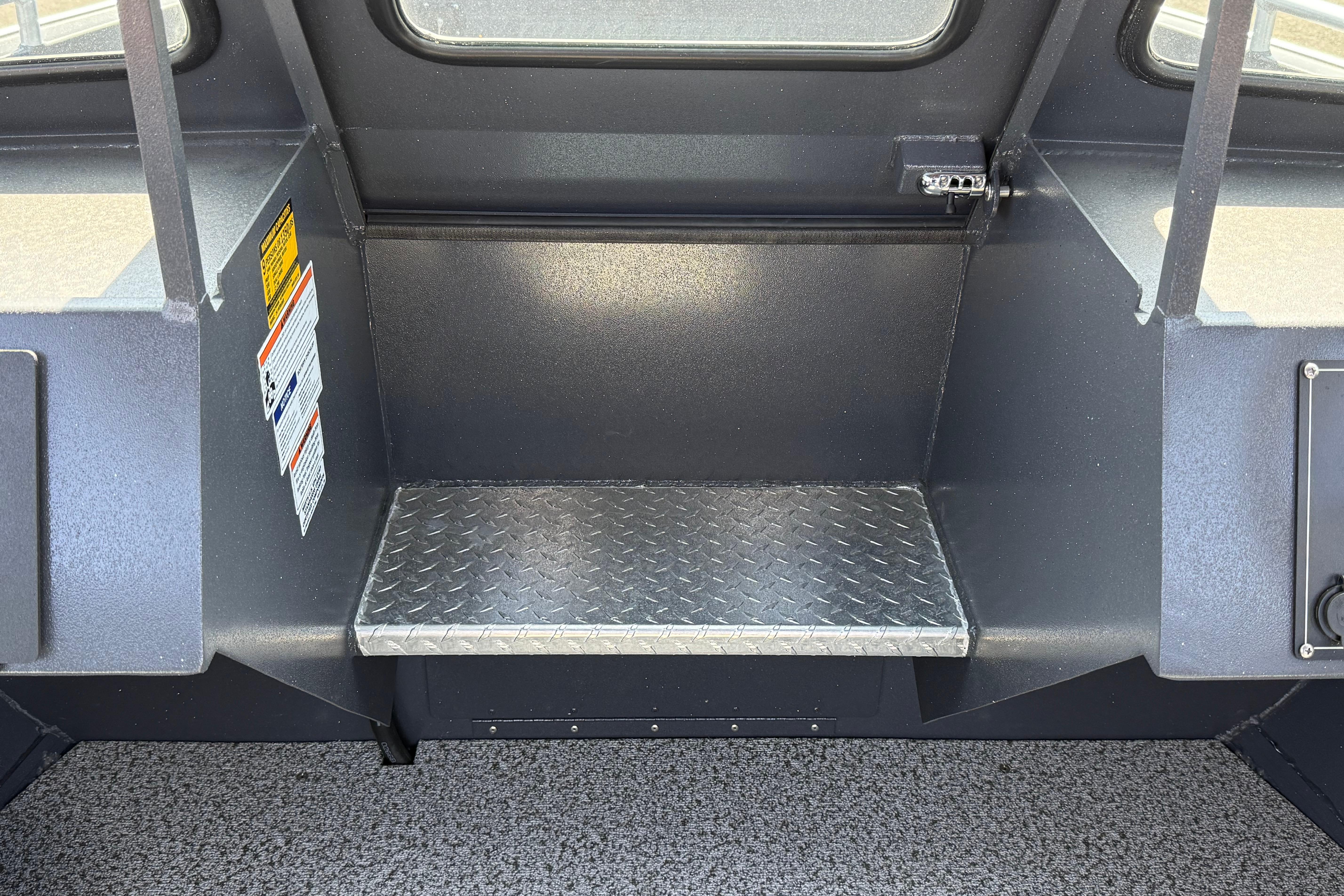 Interior of 2026 Alumaweld Intruder 22 boat with diamond plate step.