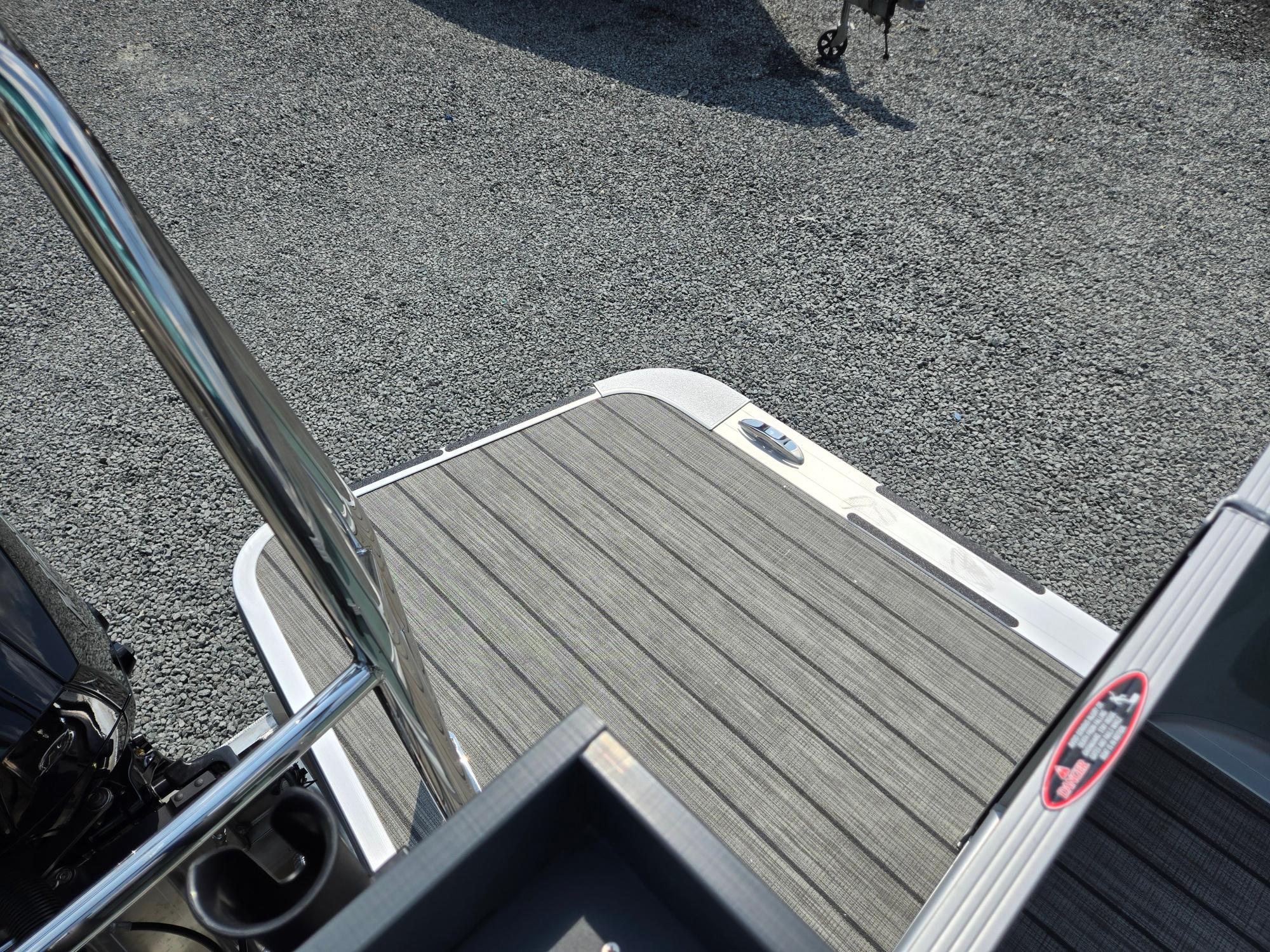 2026 Harris Cruiser 210 boat deck with sleek design and durable flooring.