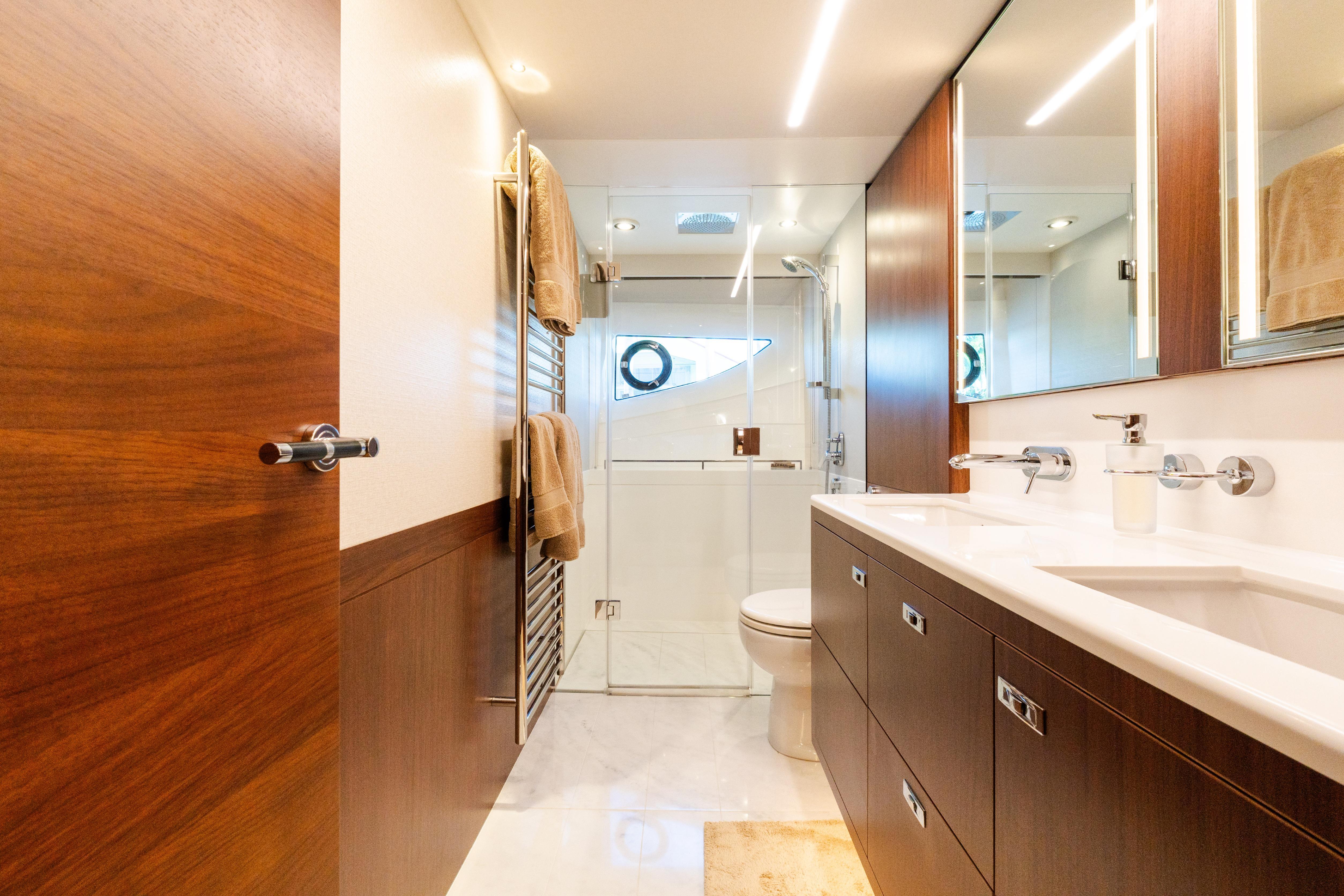 Luxurious bathroom in 2019 Princess S78 yacht with modern fixtures and wooden accents.