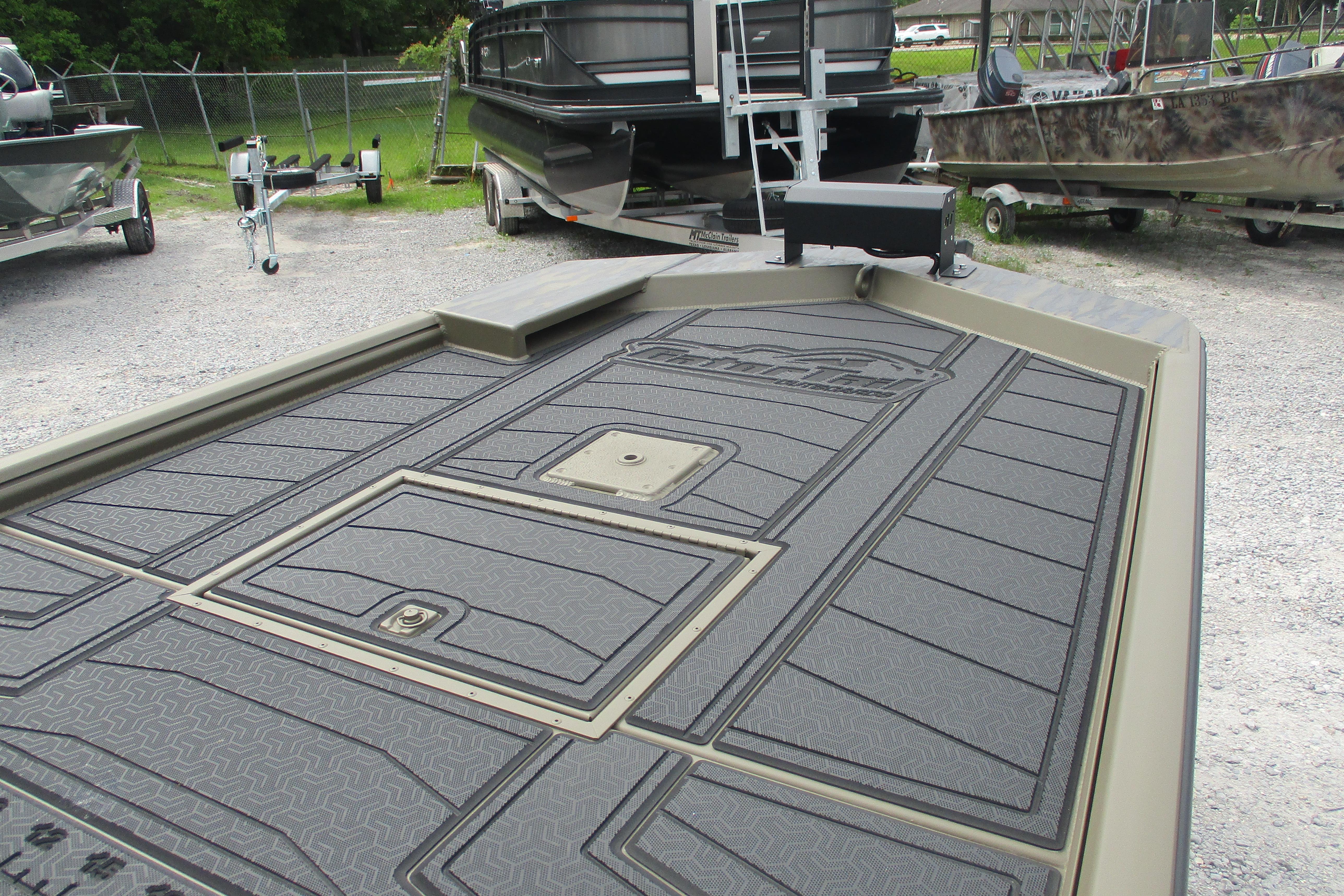 2026 Gator Tail 2060 Extreme CC boat deck with textured flooring, parked outdoors.