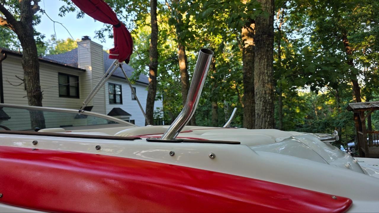 2005 Crownline 216 LS boat in wooded area, close-up view.