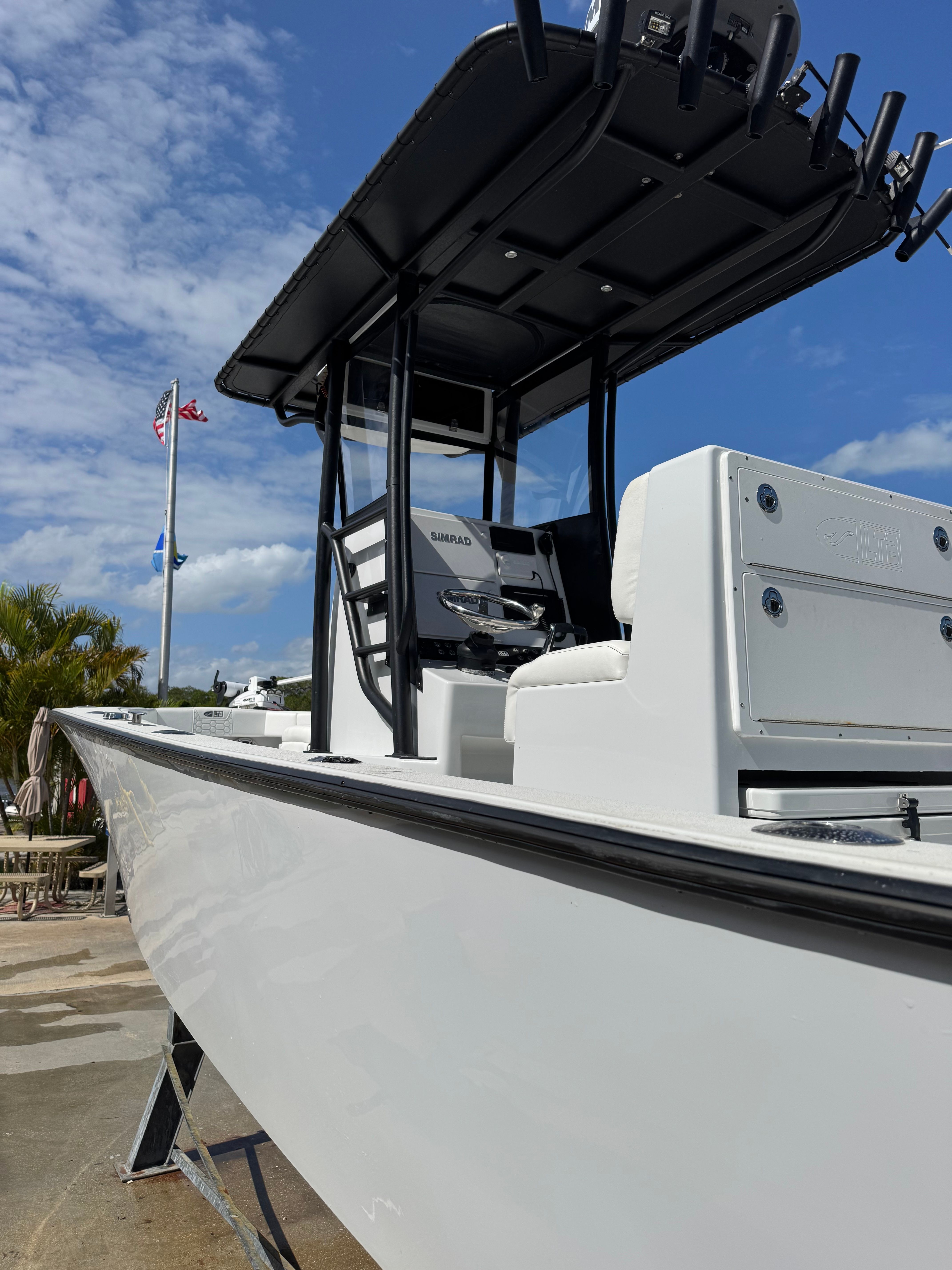 2024 Latitude Tournament Boats 25' CC on a sunny dock.