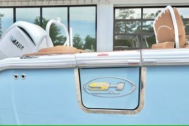 2026 Sea Hunt Ultra 255 SE boat with Yamaha engine, light blue exterior.