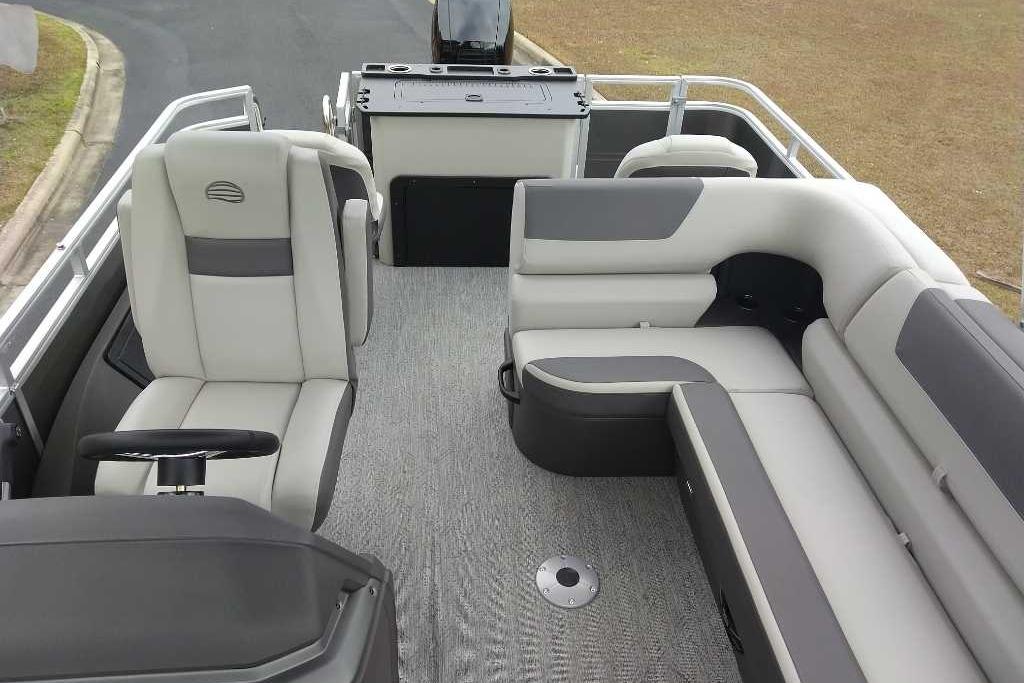 2026 Sun Tracker Fishin' Barge 22 DLX interior with plush seating and modern design.