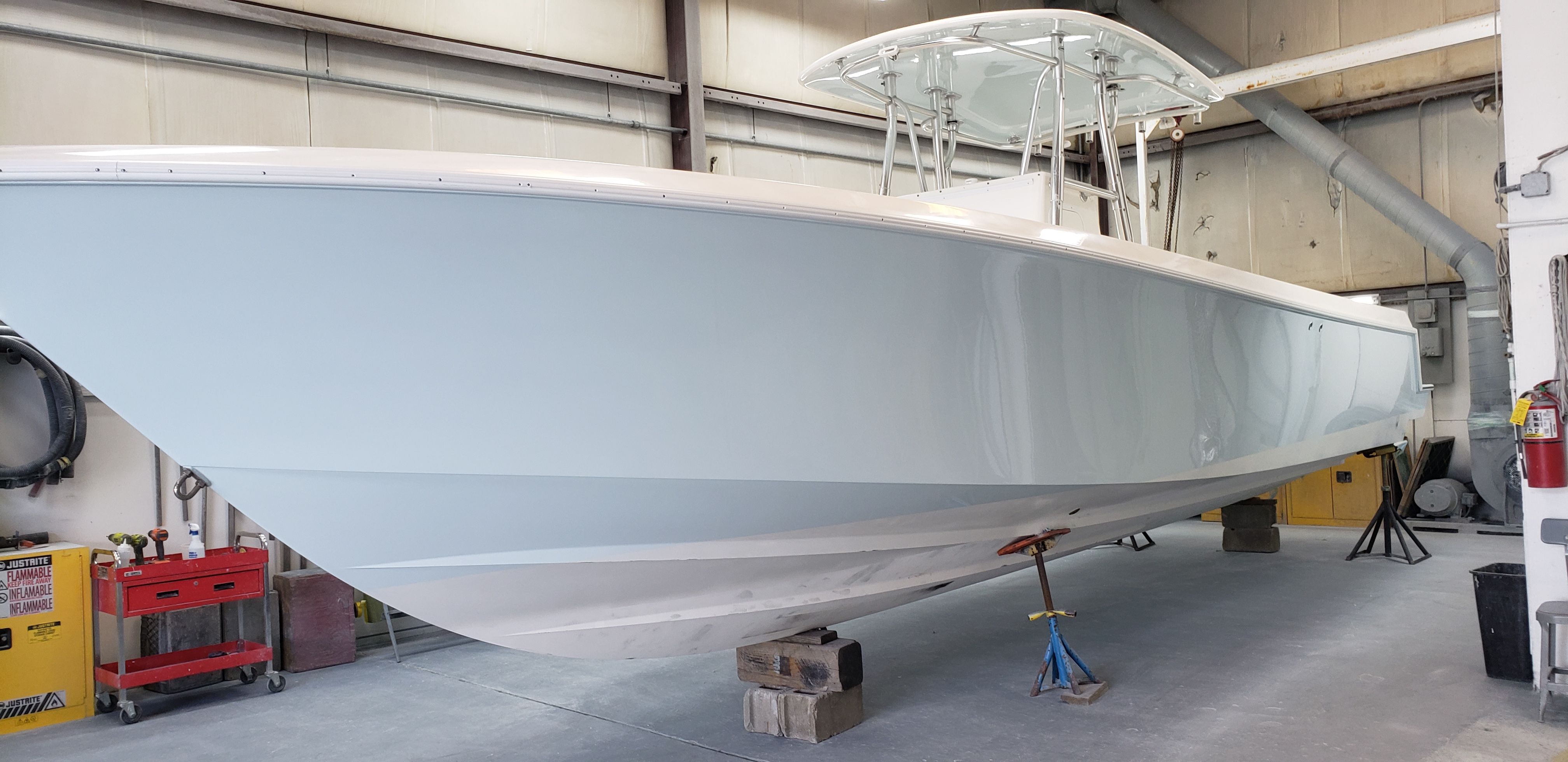 2009 Contender 33 Tournament boat elevated in workshop.