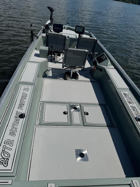 Custom Ultimate Panfish XL 2025 fishing boat on calm water.