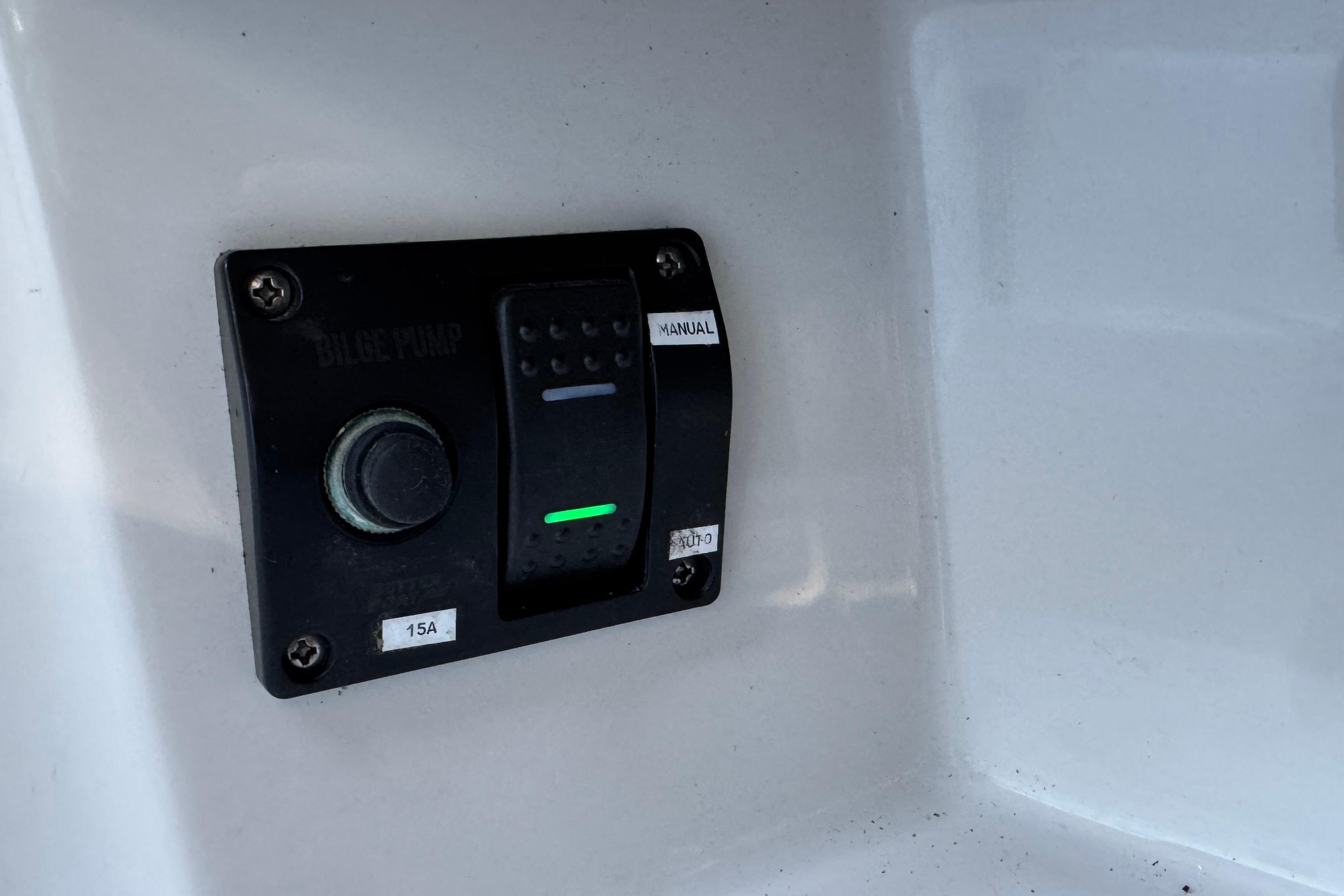 Bilge pump switch on 2003 Malibu Sportster LX boat dashboard.