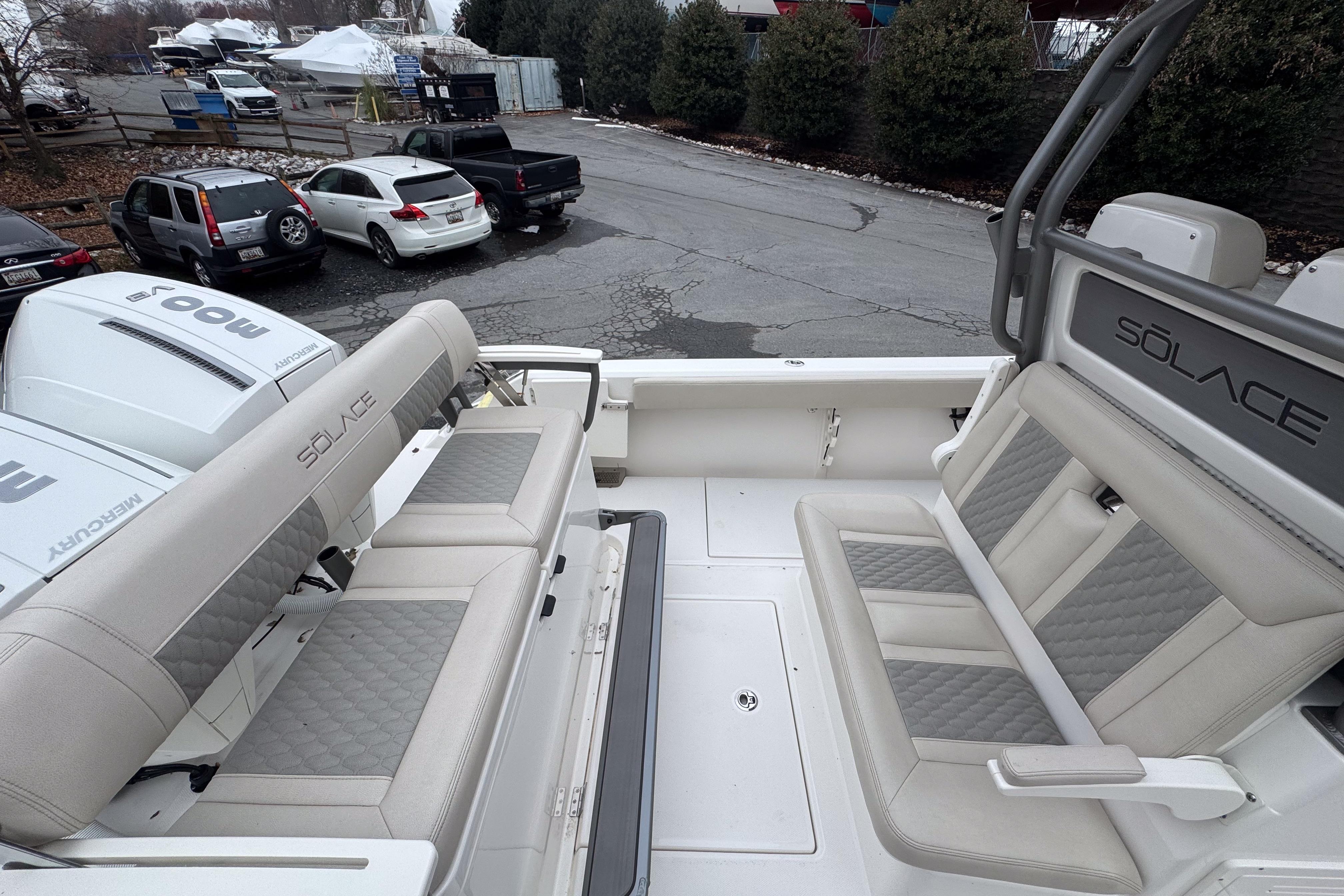 2025 Solace 30 HCS boat interior with cushioned seating and Mercury engines.