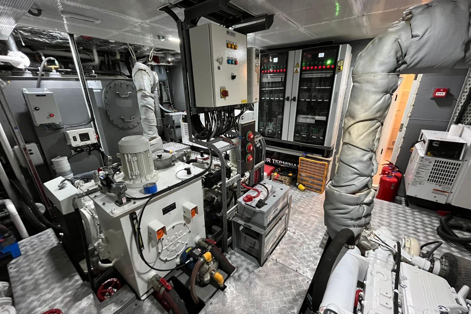 Engine room of 2024 Explorer ICE, featuring control panels and machinery.
