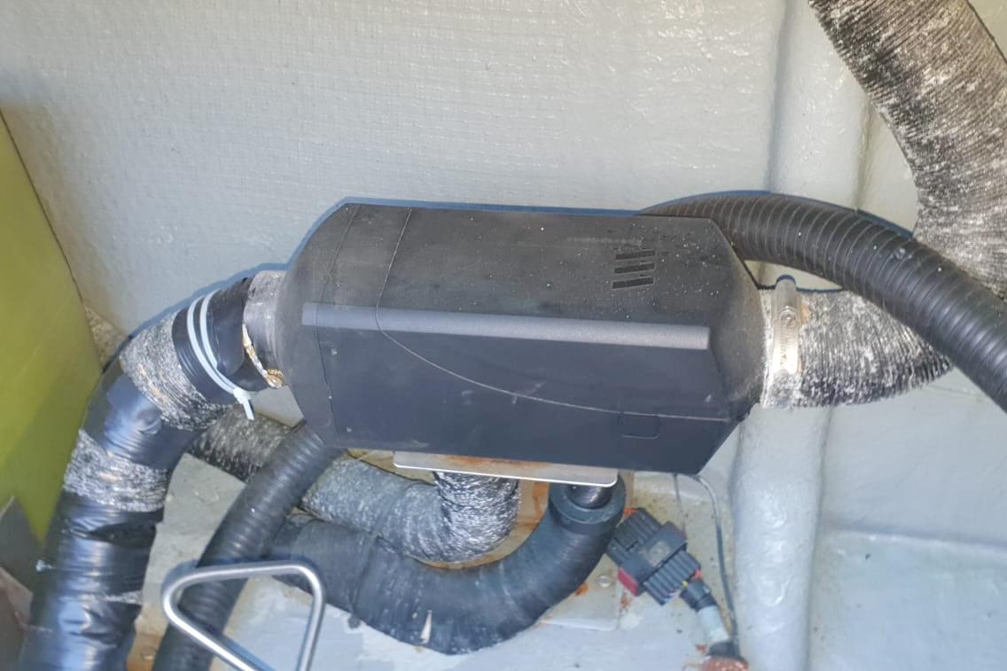 Engine compartment of 1989 Fairey Spearfish MKIII with black component and hoses.