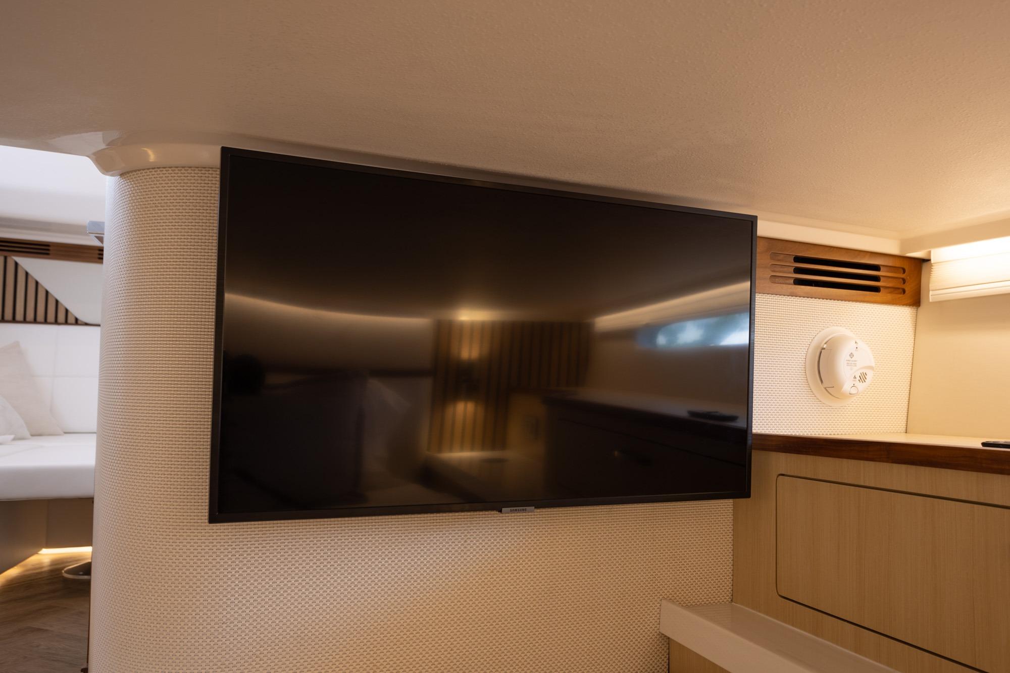 Flat-screen TV in the luxurious interior of a 2026 Regal LX43 yacht.
