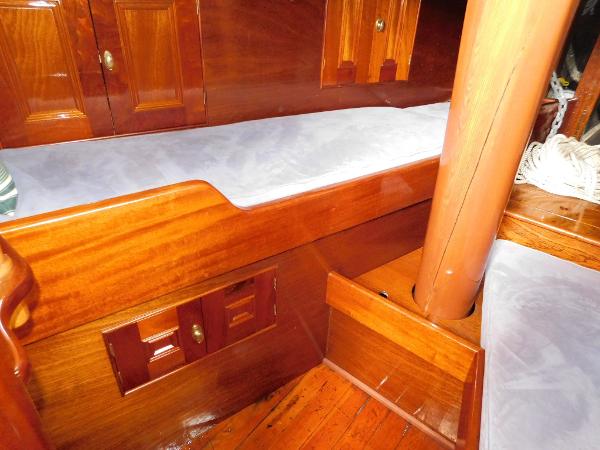 Interior of 1983 Custom Murray Peterson Coaster III with polished wood and cushioned seating.