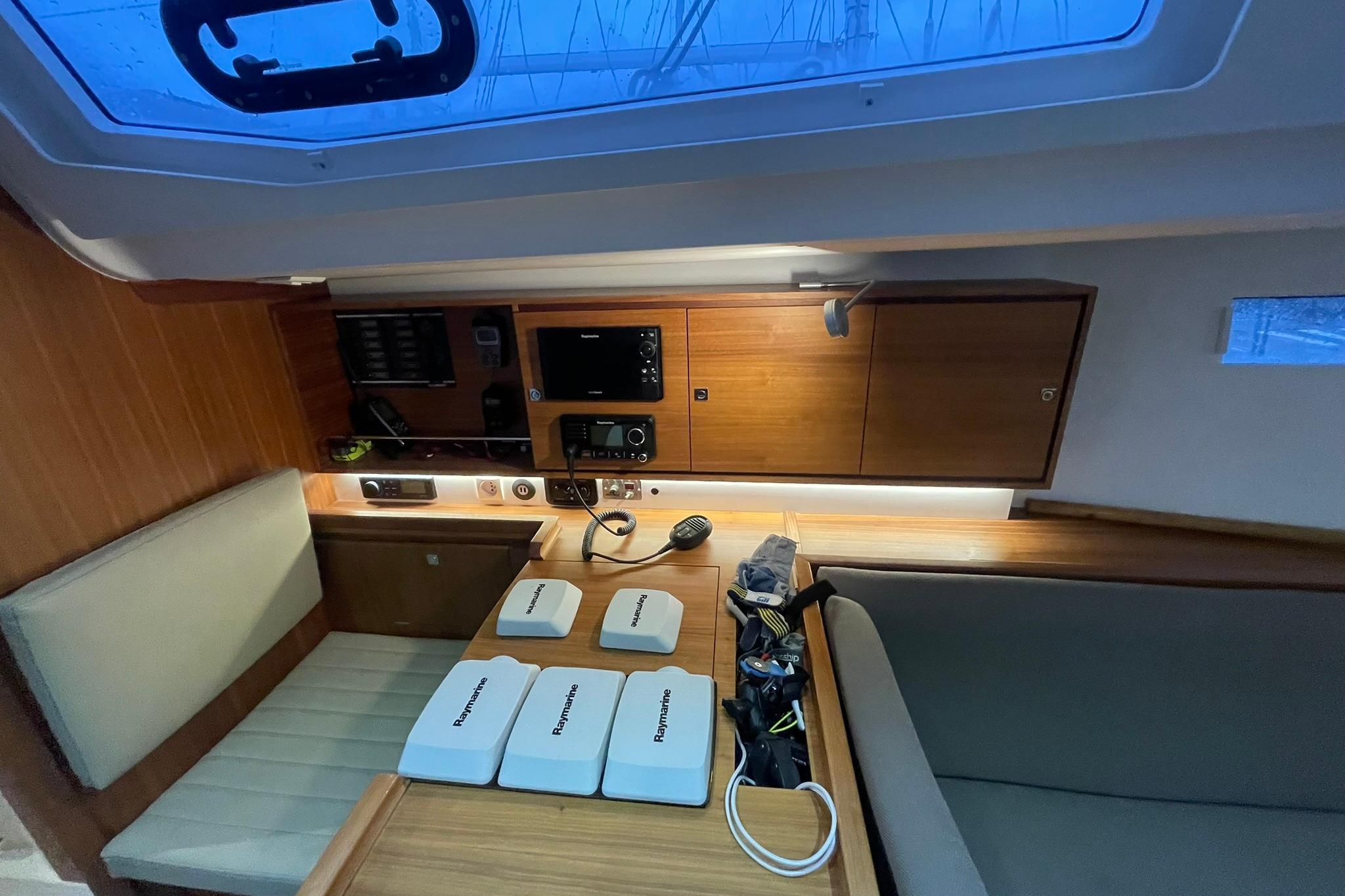 2017 J Boats J/112E interior with navigation equipment and seating area.
