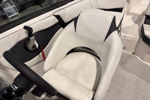 2026 Regal 21 OBX boat interior with white seating and steering wheel.