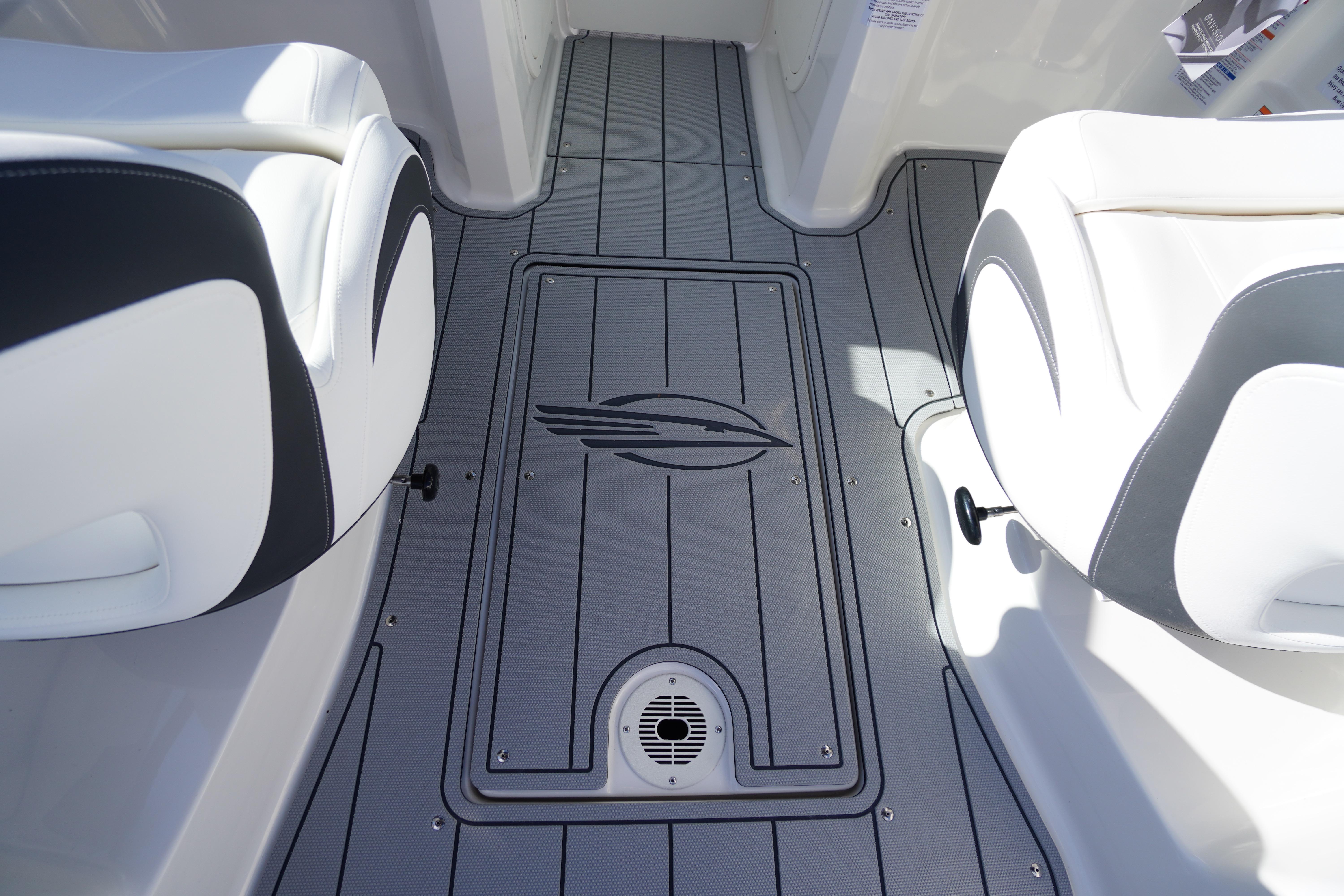 2026 Chaparral 23 SSi OB boat interior with sleek seating and stylish flooring design.