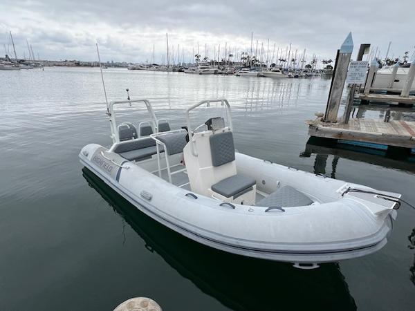 2017 Highfield OM 500 inflatable boat docked in a marina.