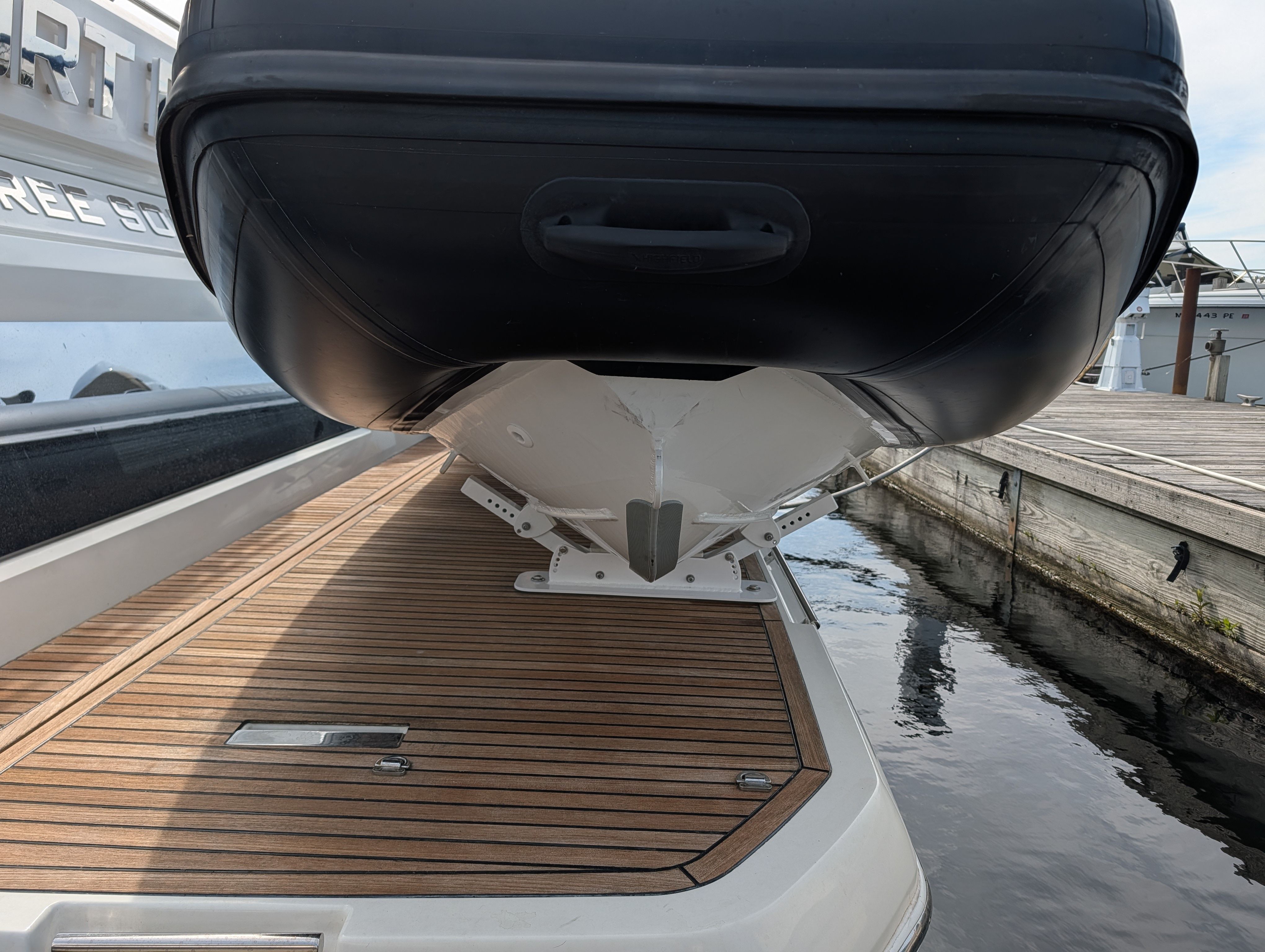 2024 Highfield Sport 390 boat on wooden deck at dock.