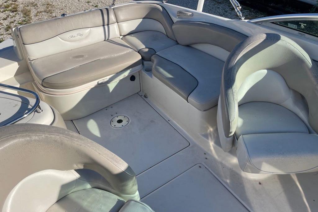 2004 Sea Ray 240 Sundeck interior with spacious seating and elegant design.