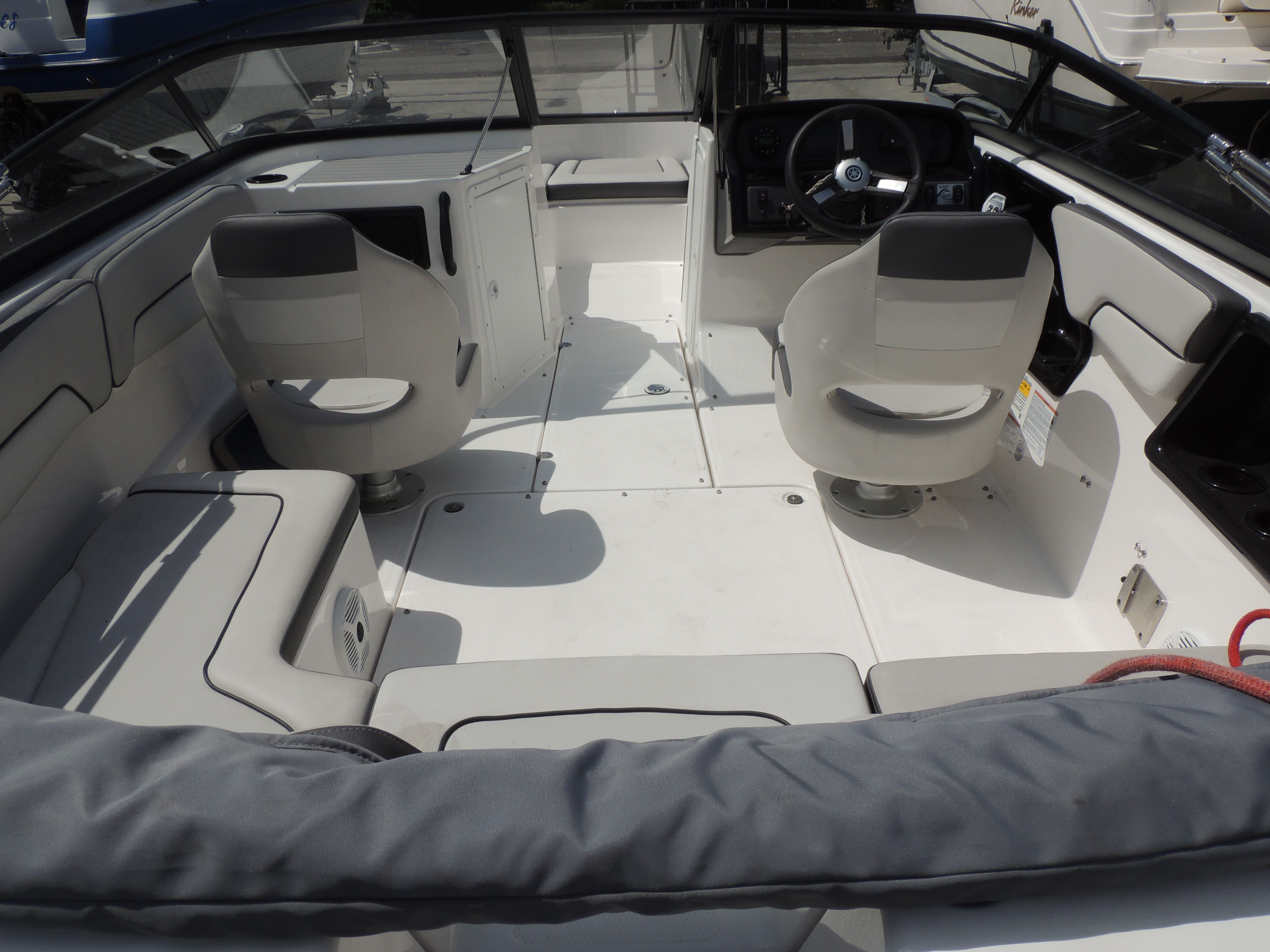 Interior of a 2023 Yamaha SX190 boat with gray seating.