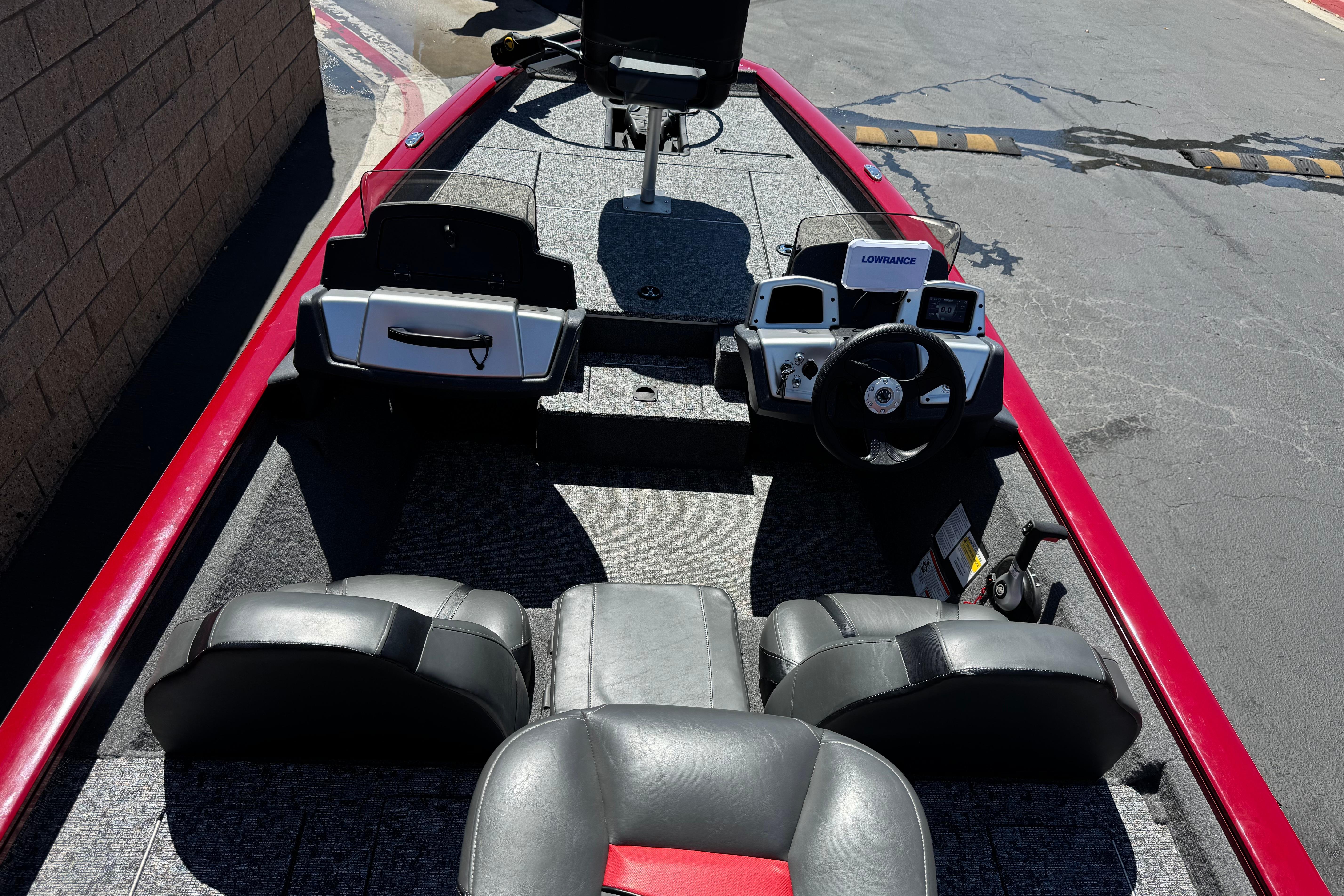 2025 Tracker Pro Team 175 TXW boat interior with steering console and seating.