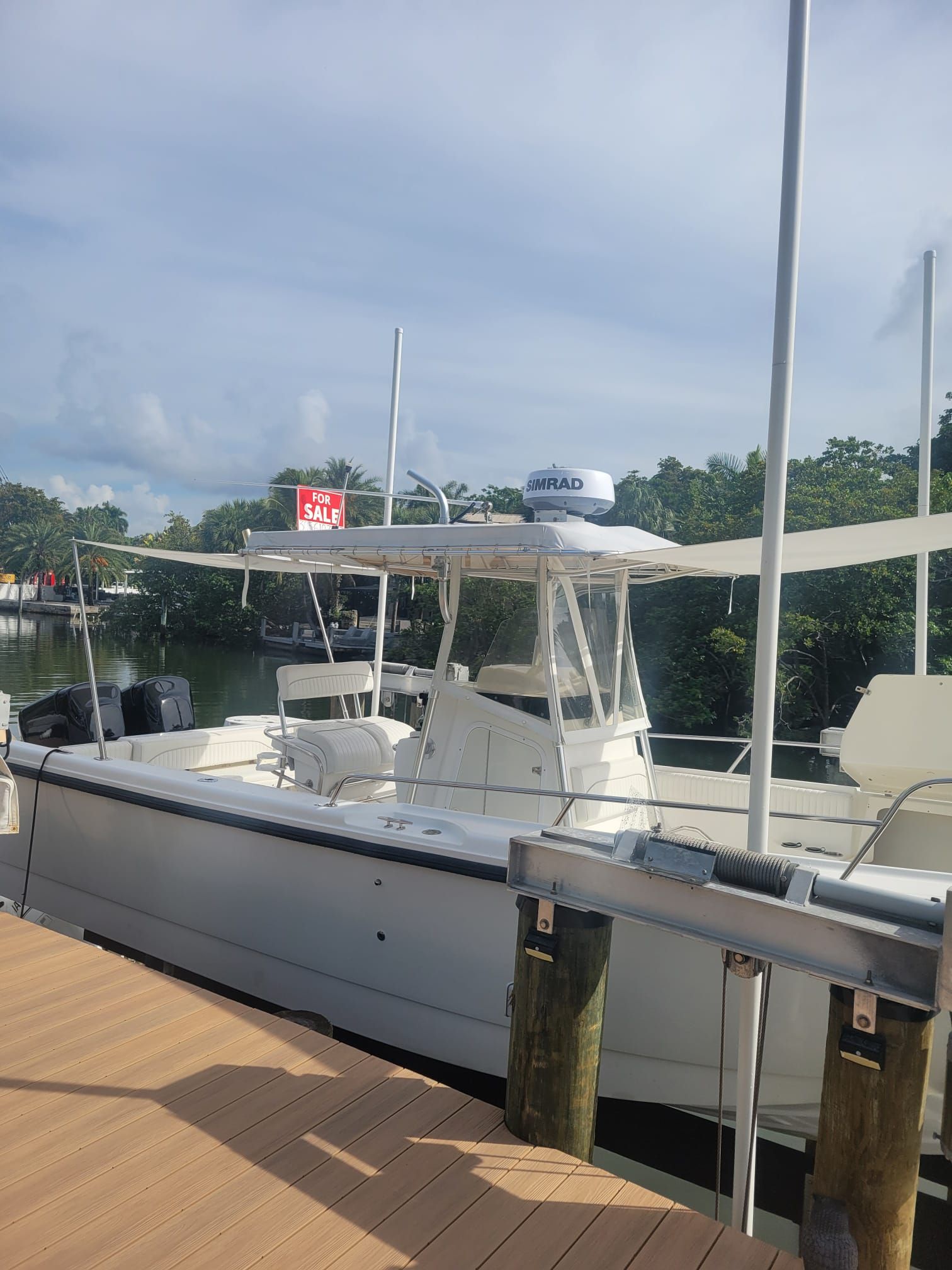 2001 Boston Whaler 26 Outrage boat for sale at dock.
