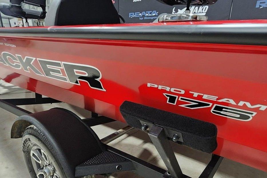 Red 2026 Tracker Pro Team 175 boat on trailer, showcasing sleek design and branding.