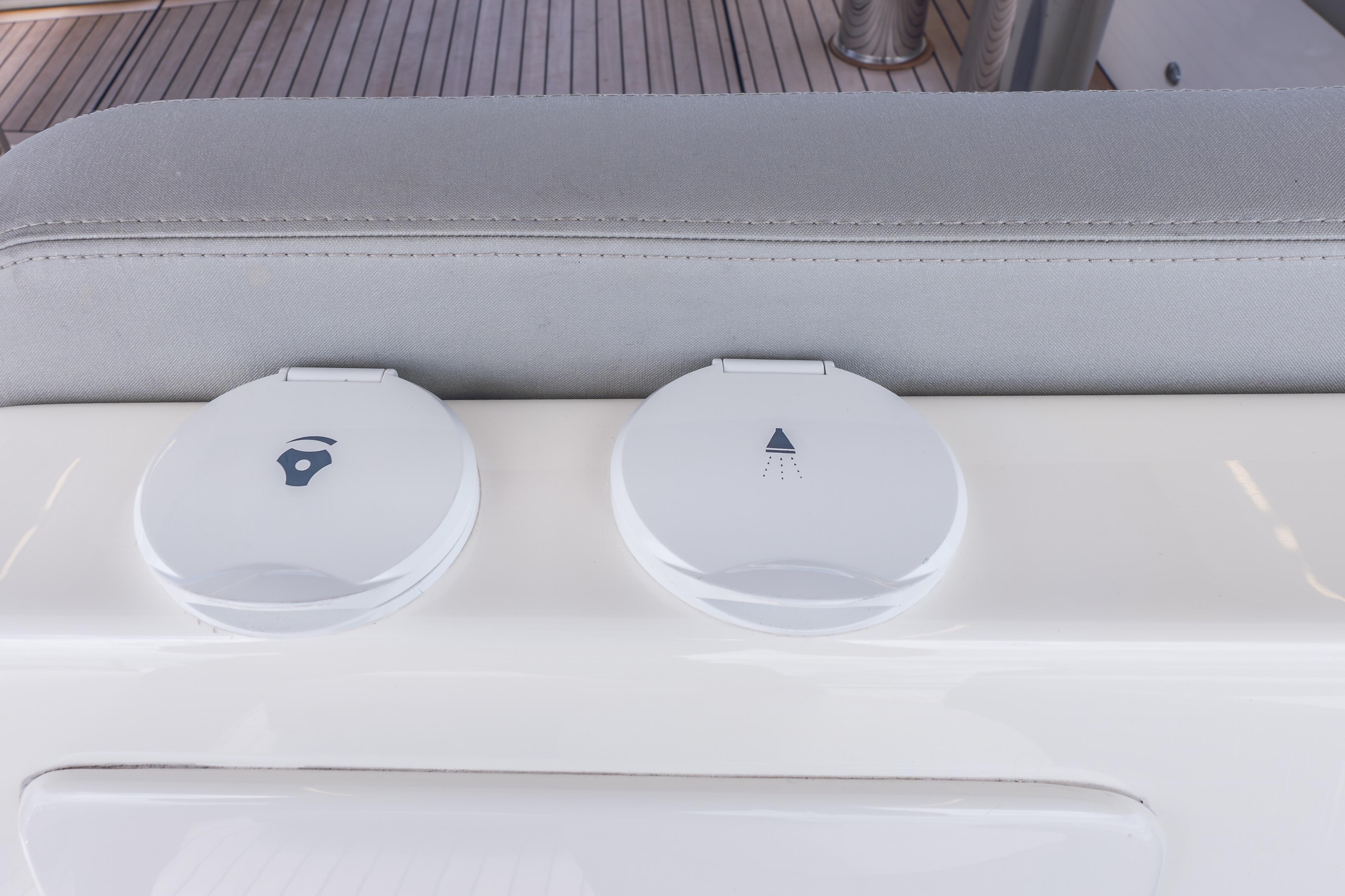 White control panels on 2019 Absolute 58 FLY yacht deck, featuring sleek design elements.