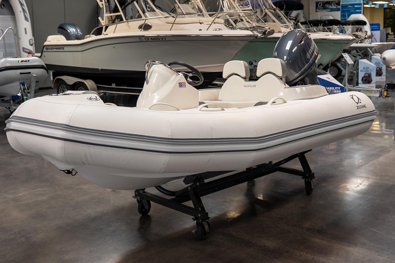 2026 Zodiac Yachtline 360 inflatable boat displayed indoors on a wheeled stand.